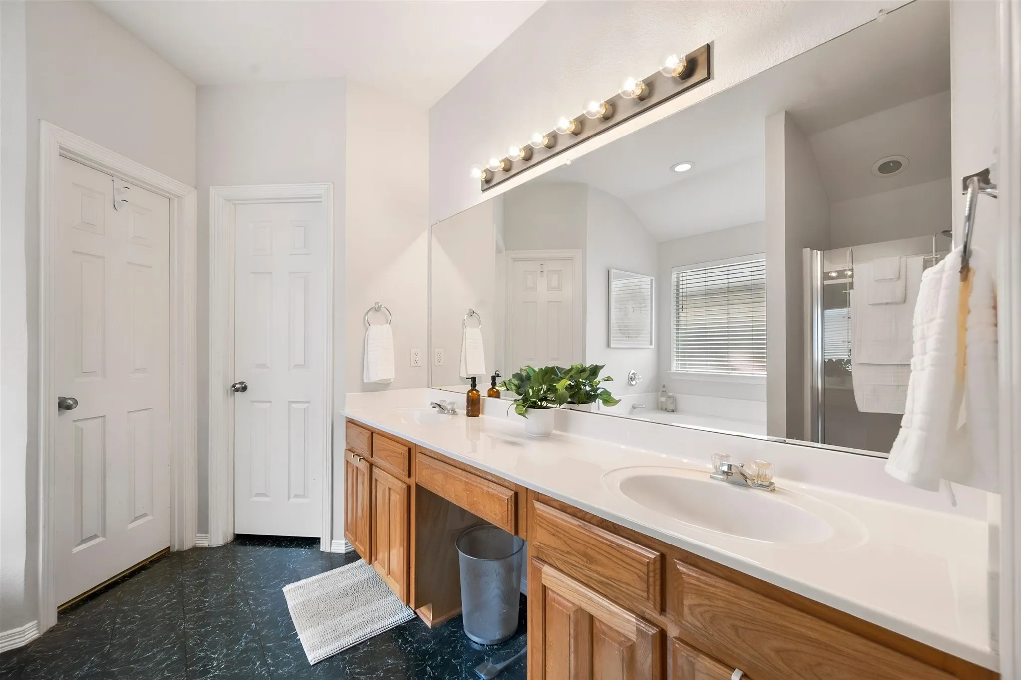 Light & bright Dual sink vanity in the primary bathroom