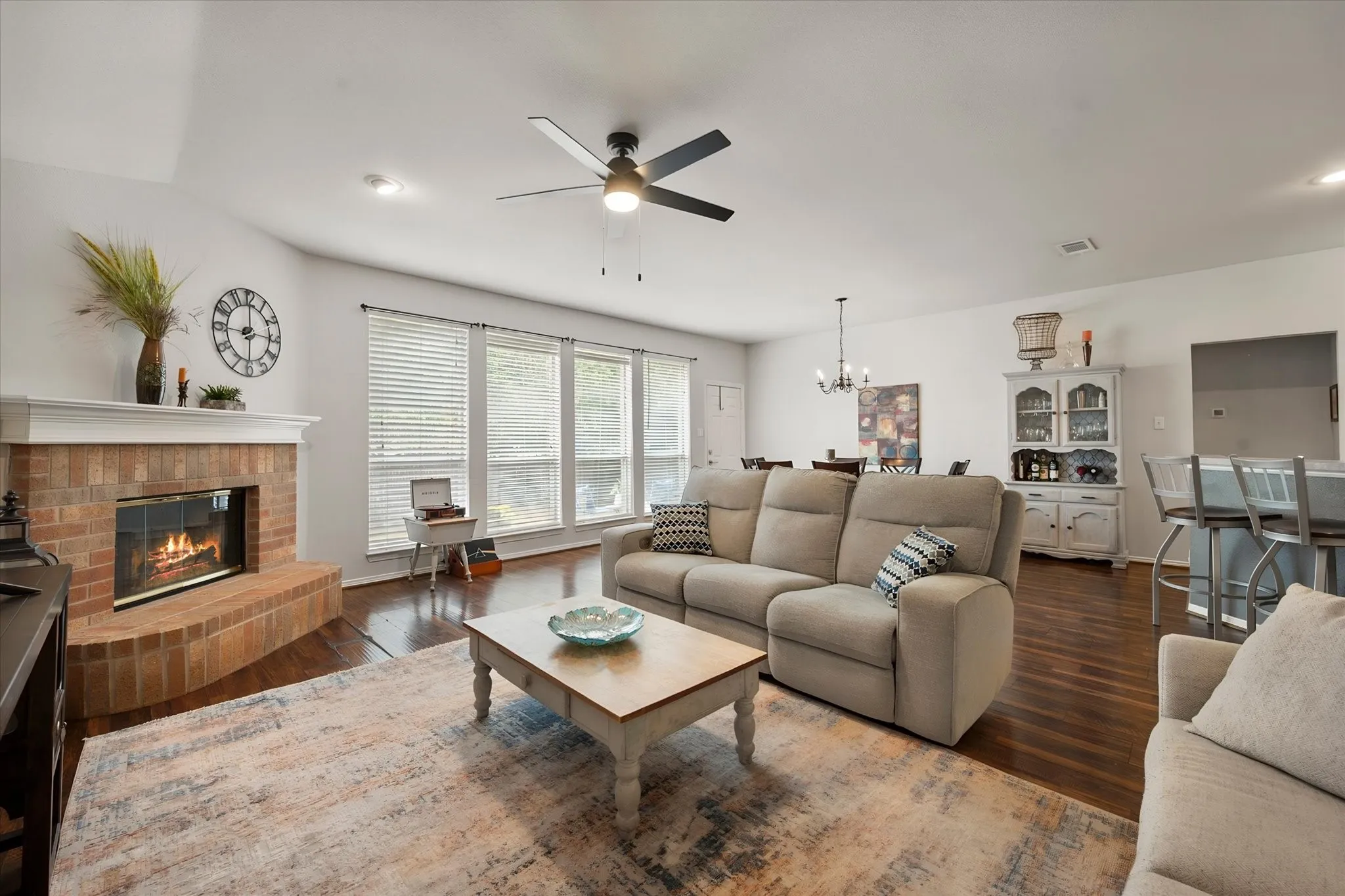 Enjoy this light filled living, dining great room with fireplace!
