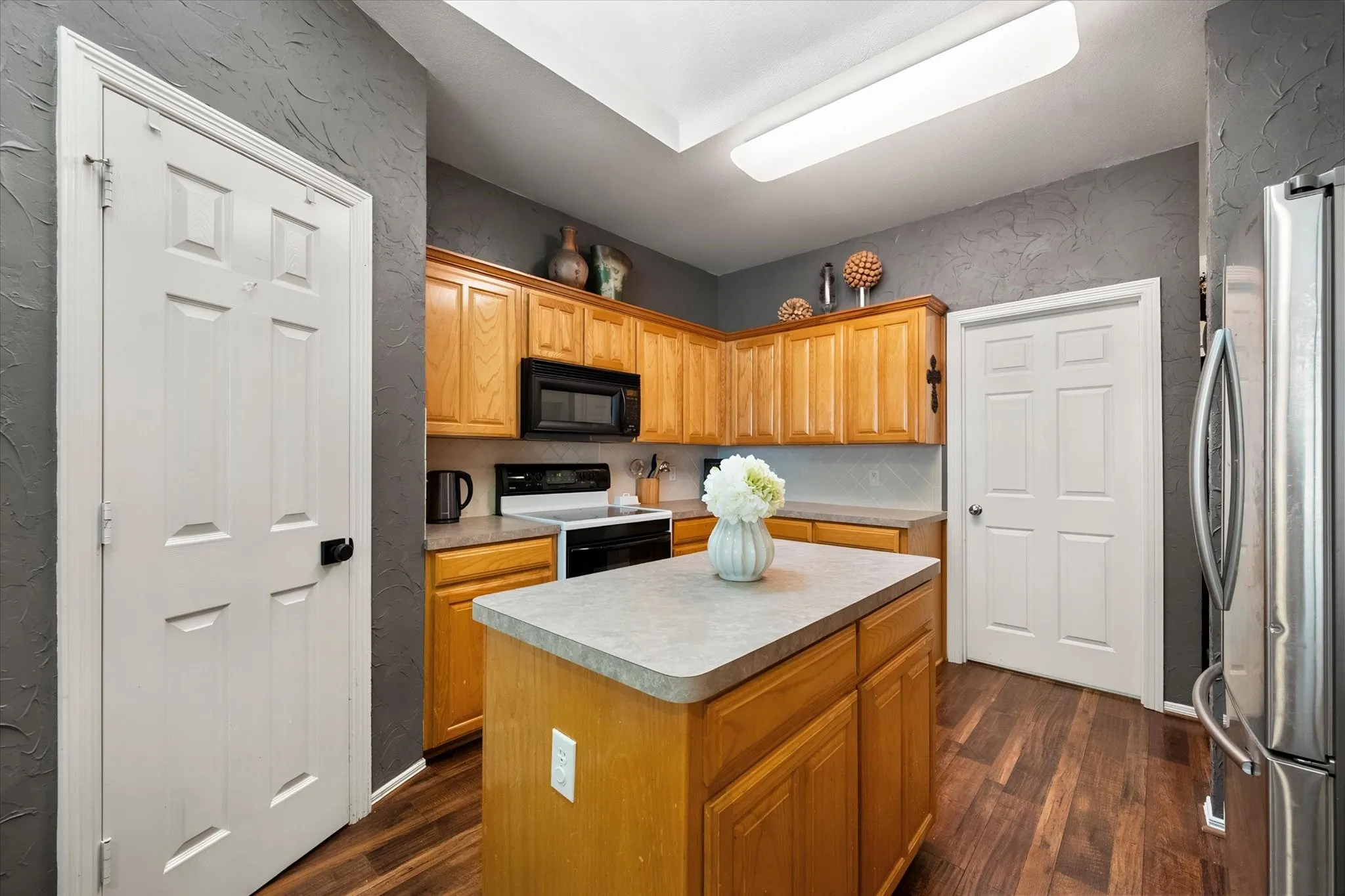 Pantry and center island add to the storage space and functionality!