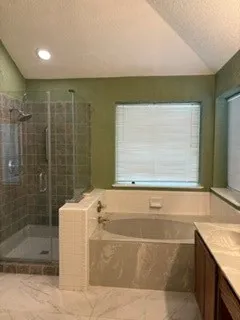 Owner's suite garden bath with separate tub and walk in shower