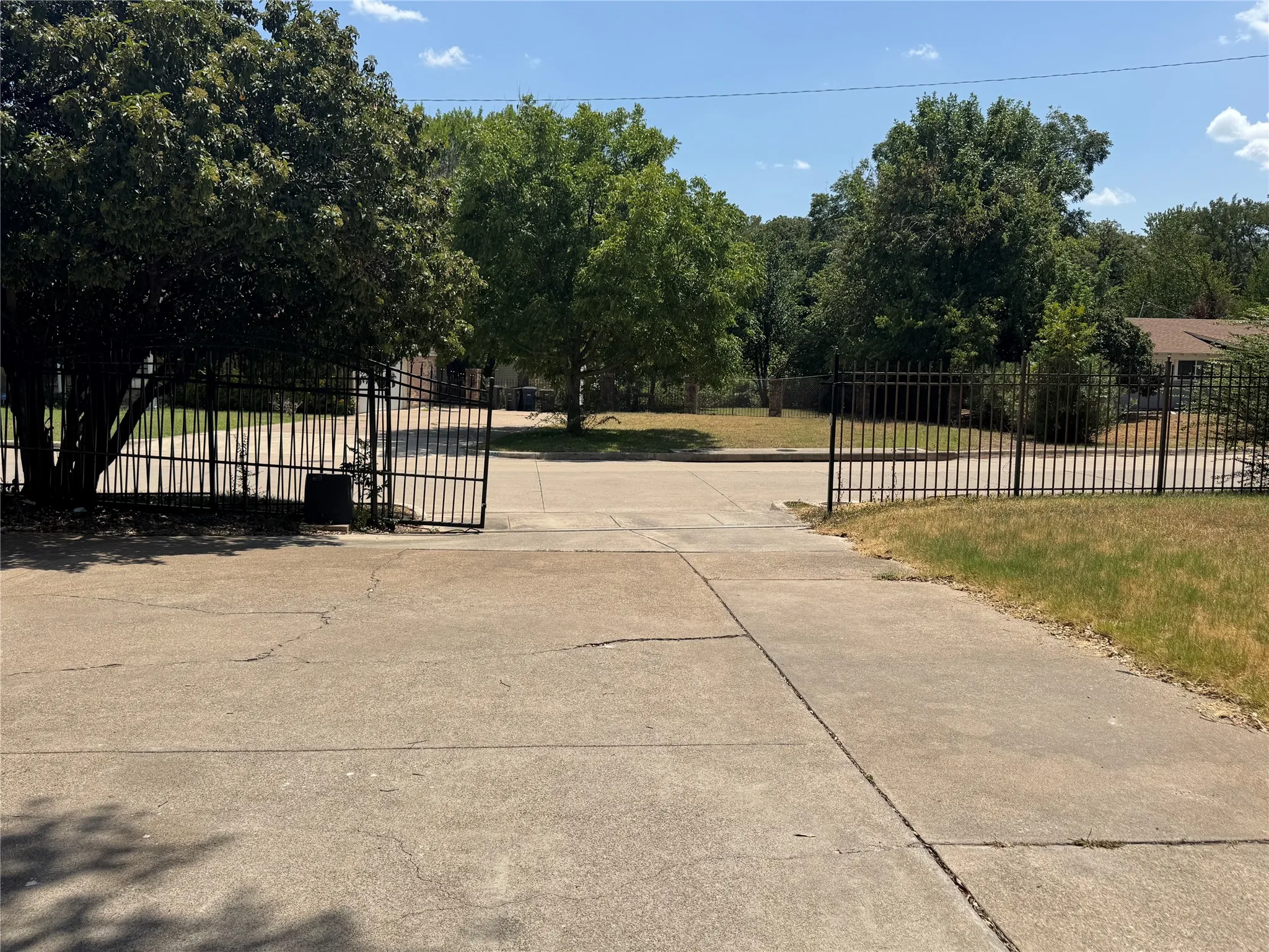 Rear entry garage with iron gate