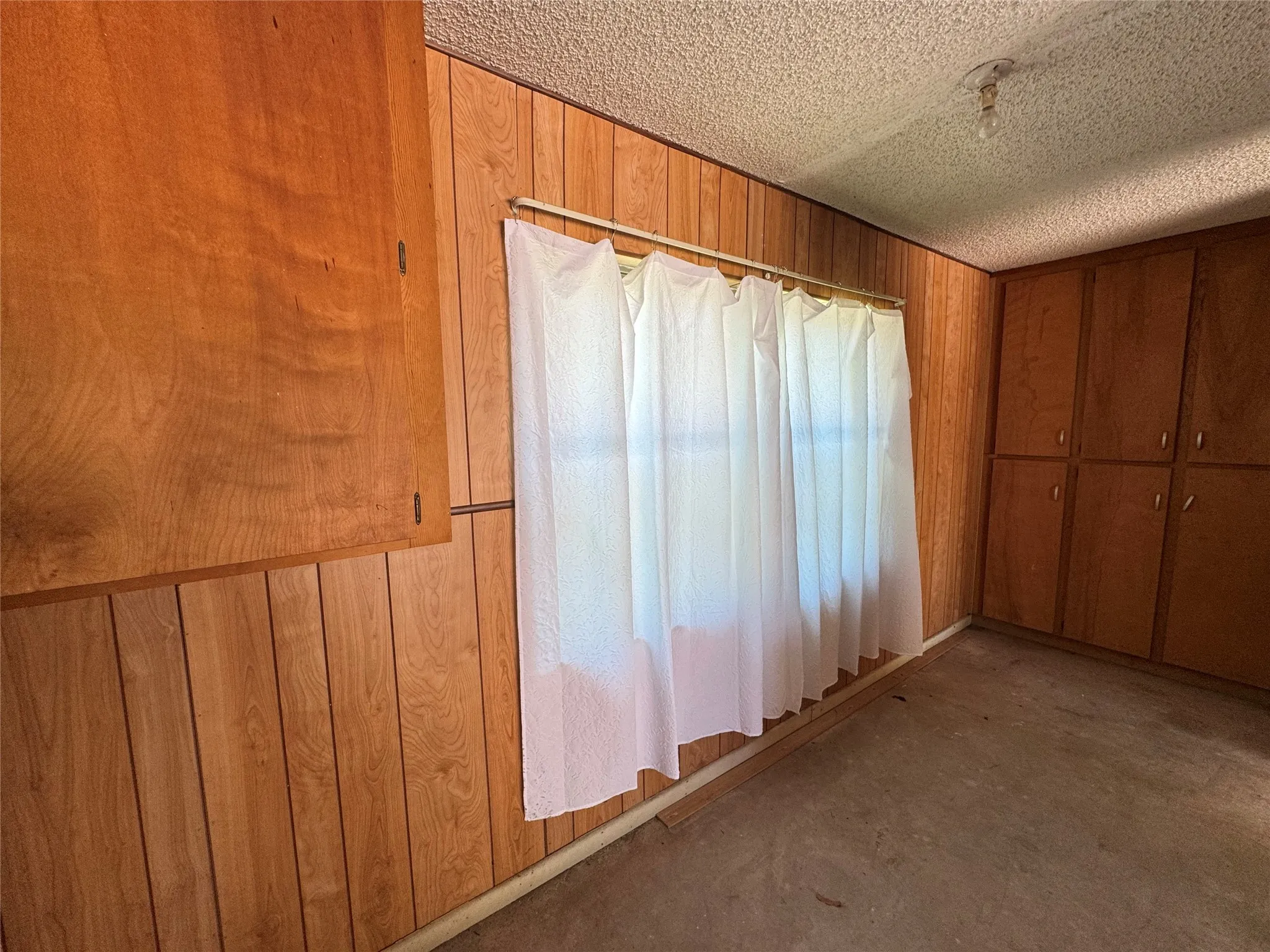 Storage space in garage with built-in cabinets