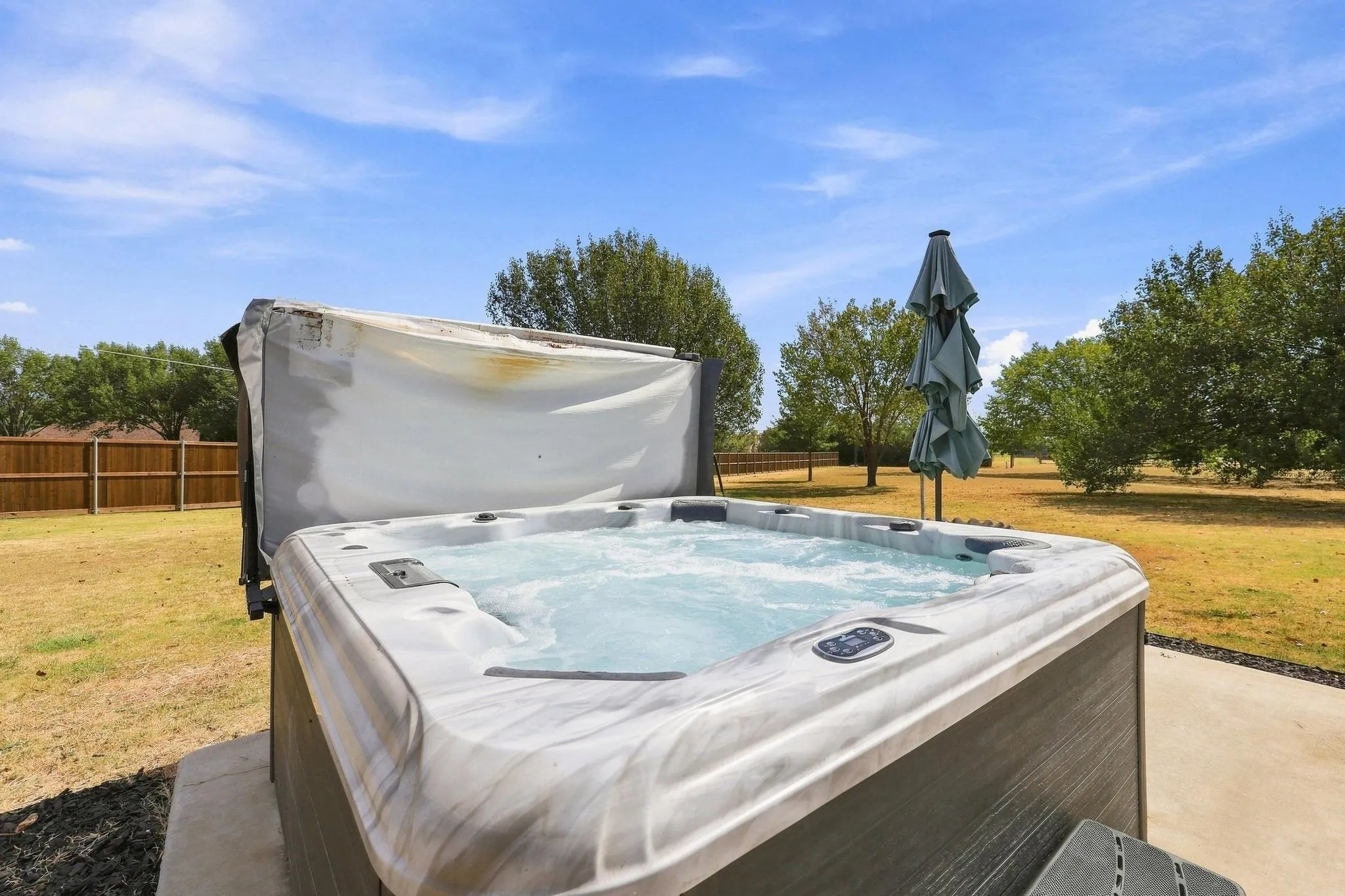 7 person like new hot tub that conveys with the property.