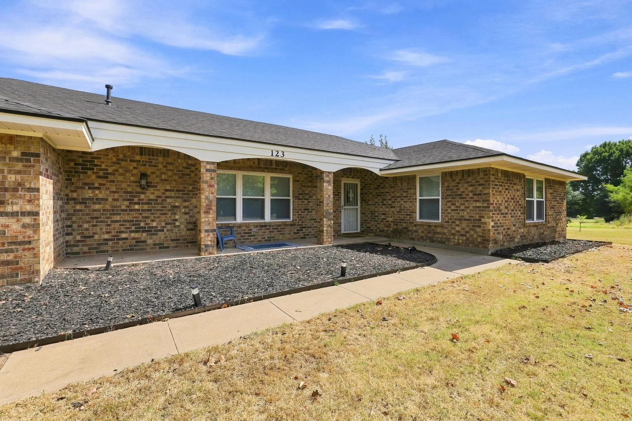 A ranch style home sitting on over; an acre with a large front porch to for star gazzing at night!