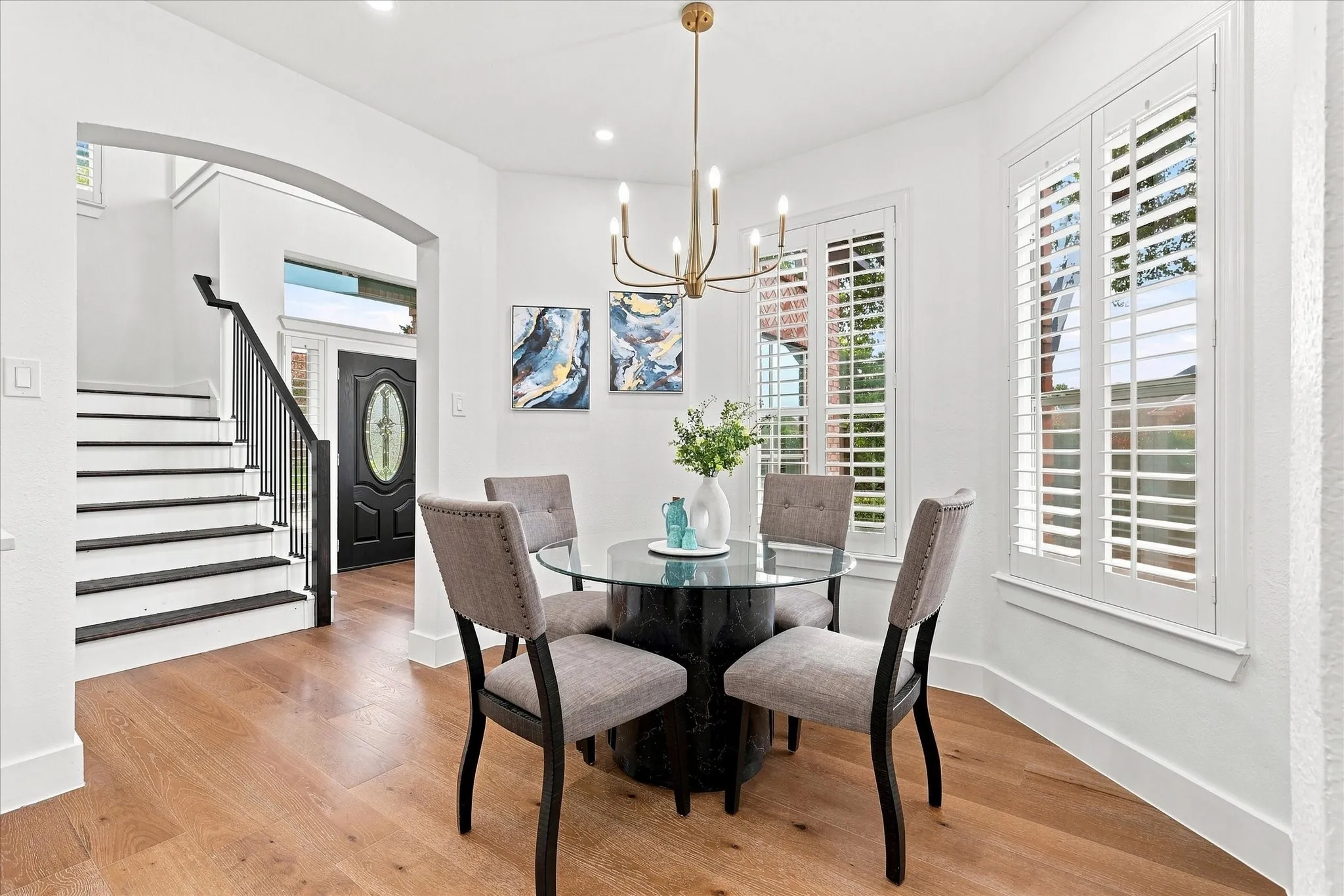 Upgraded loght fixtures, luxury engineered wood, shutters throughout the down stairs, wooden steps with wrouth iron balustrades.