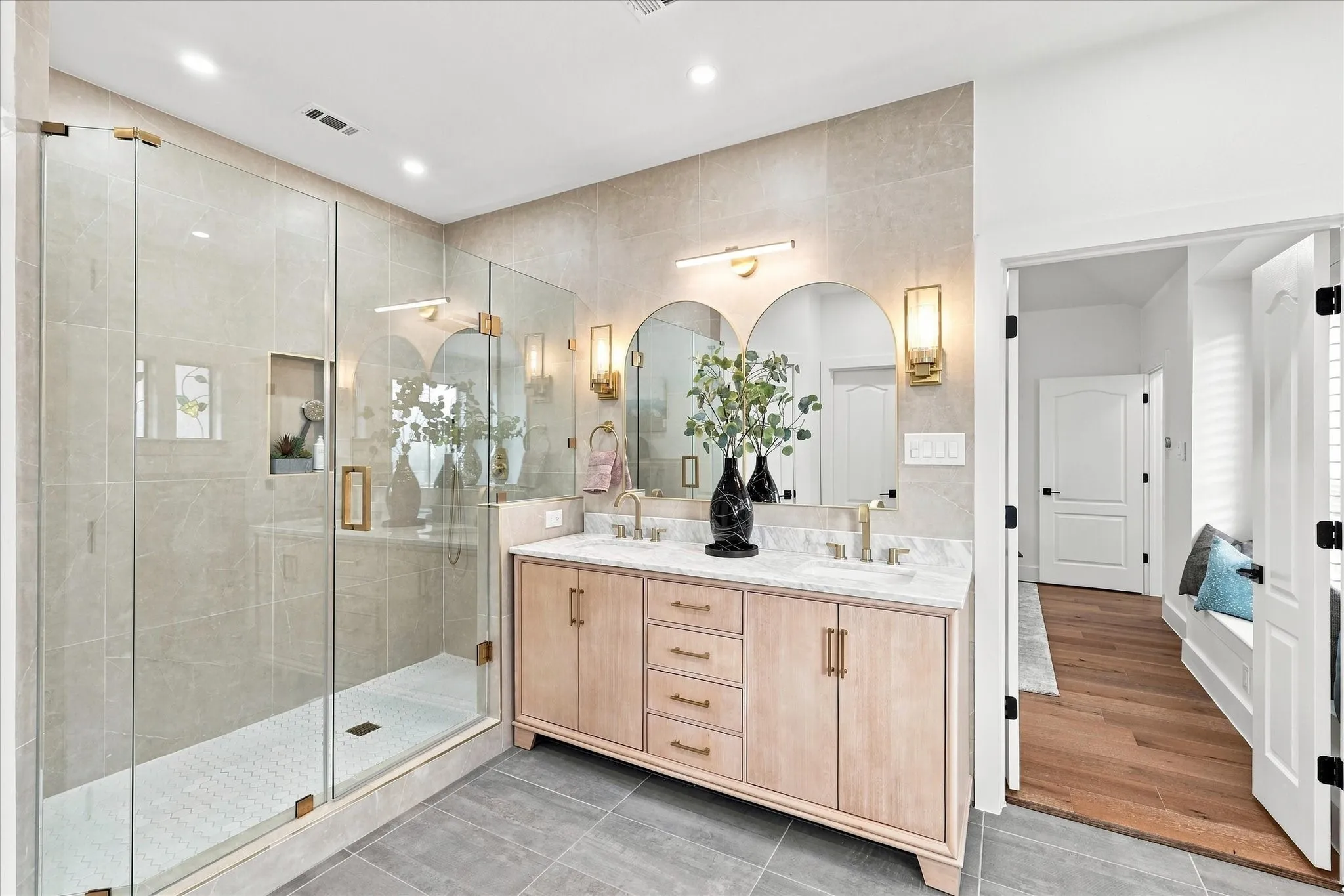 The primary bath feels like a spa.Oversized shower, can lights, fabulous mirrors and vanities