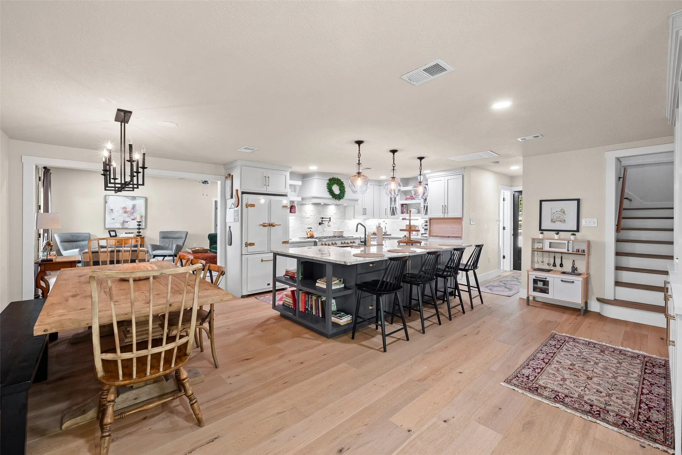 Dining area opens into the kitchen, perfect for entertaining.