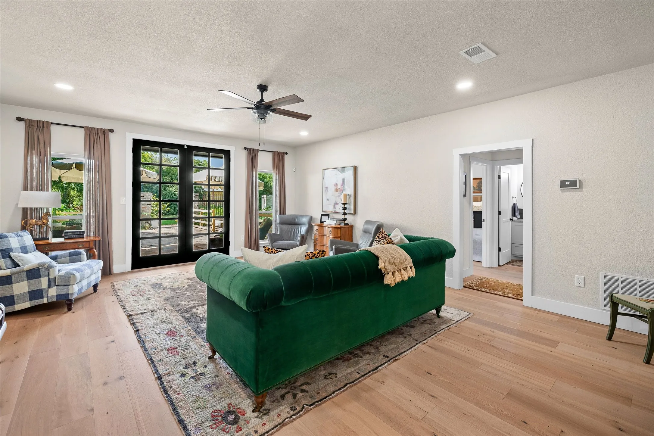 Back doors lead out to a beautiful, serene backyard. Keep scrolling to see!