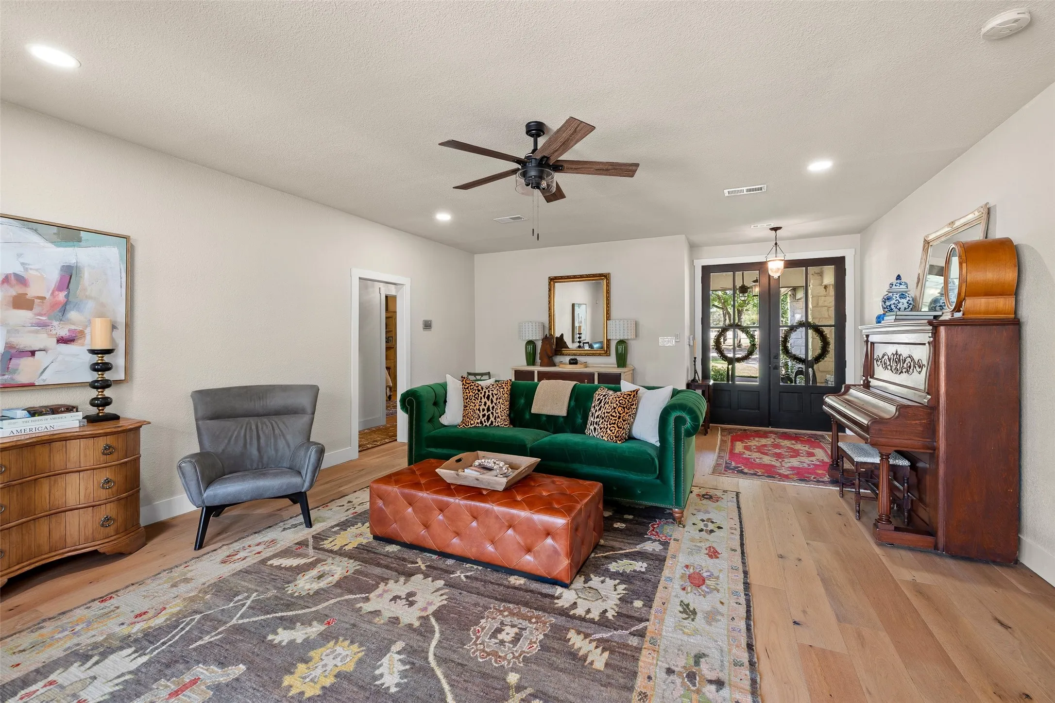 Upon entry, you are greeted by beautifully redone floors and a cozy living space.