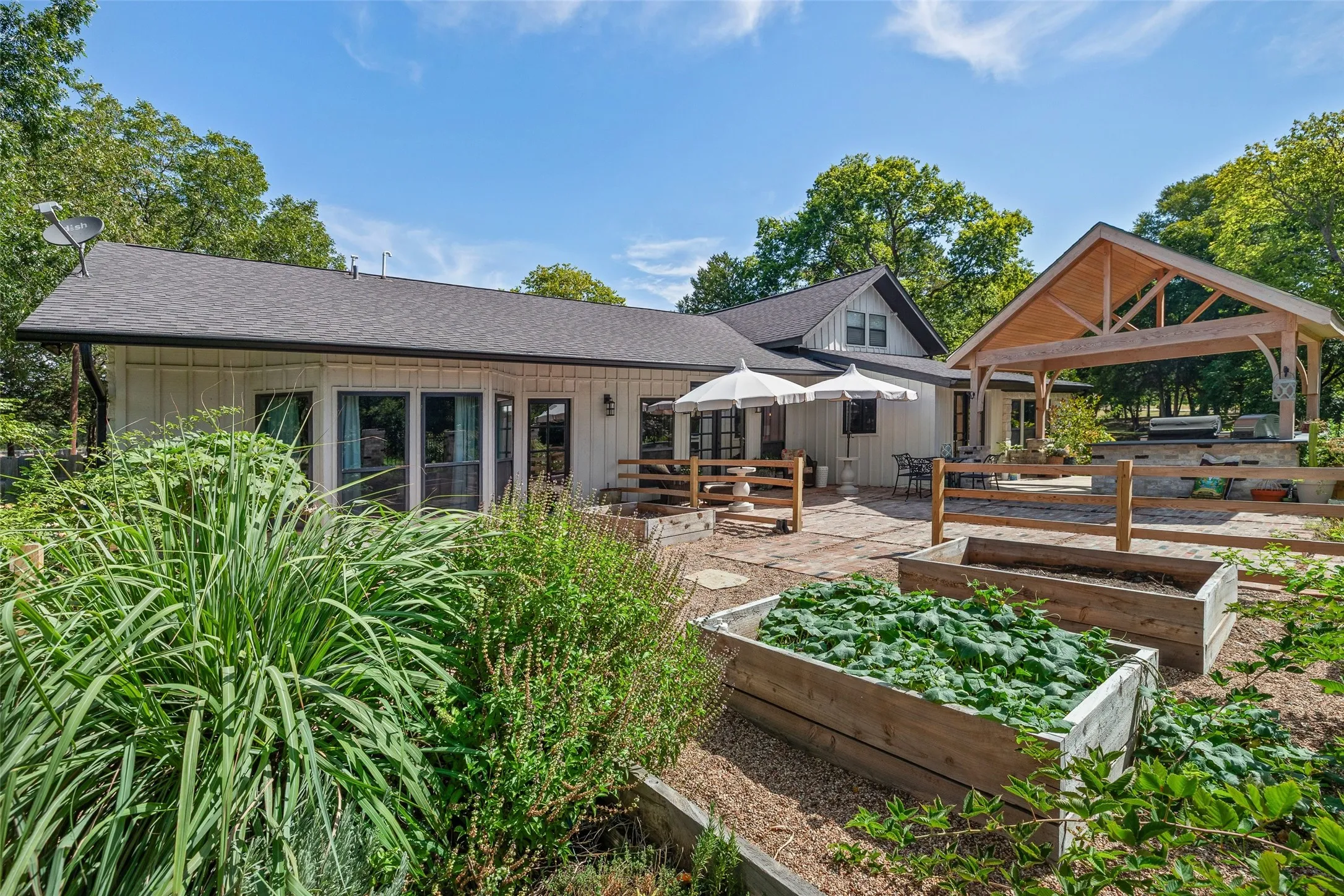 Back side view of those raised gardens and the patio.