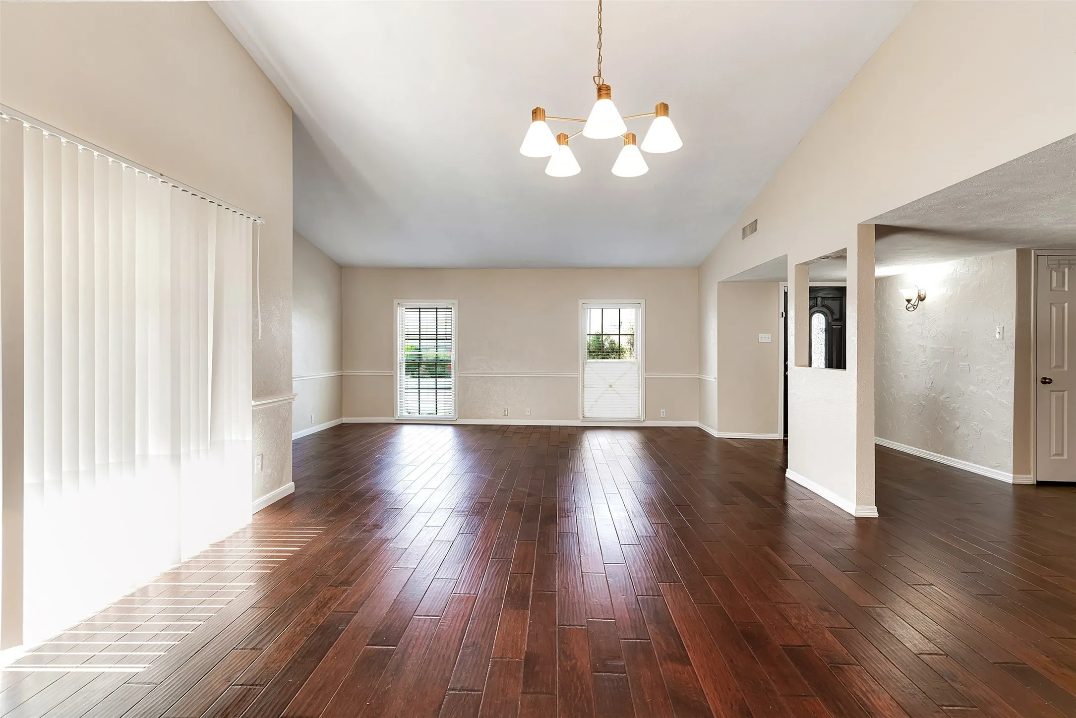 Dining Area And Living Room With Wood Floors