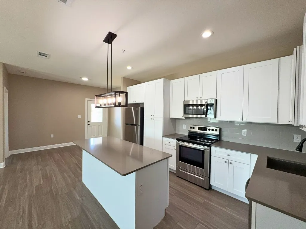Island kitchen with stainless appliances