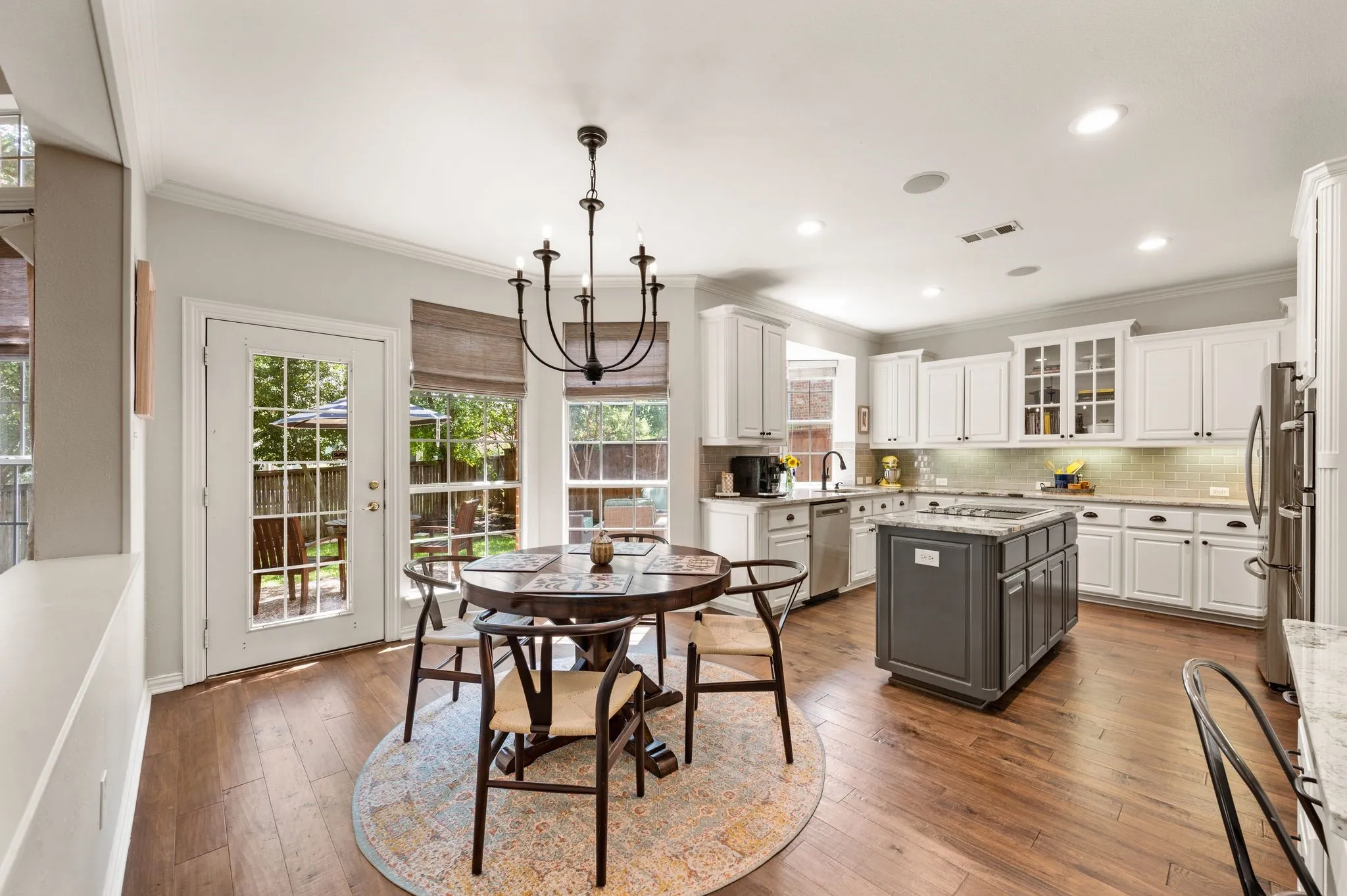 The cheerful breakfast area connects seamlessly to the kitchen and offers convenient access to the backyard.