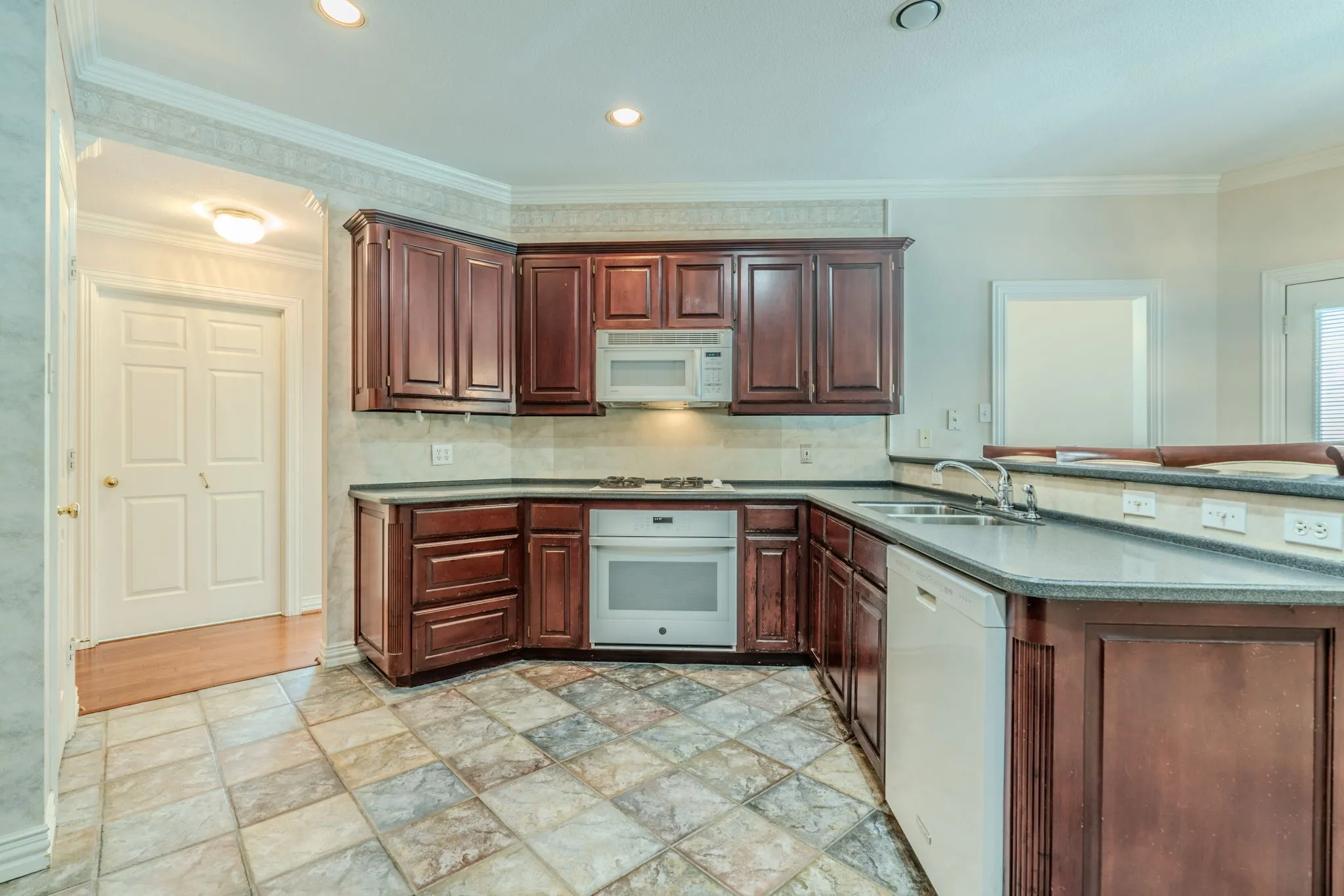 spacious kitchen with abundant cabinet and counter space and a butler's pantry
