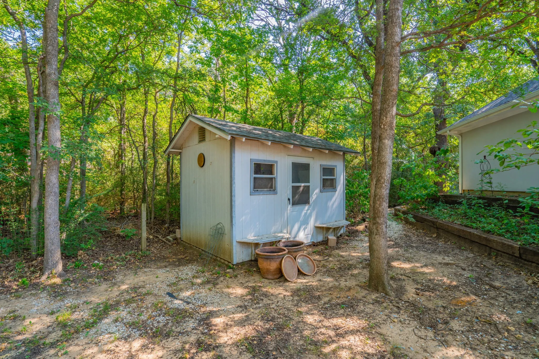 A storage shed for yard & gardening tools

