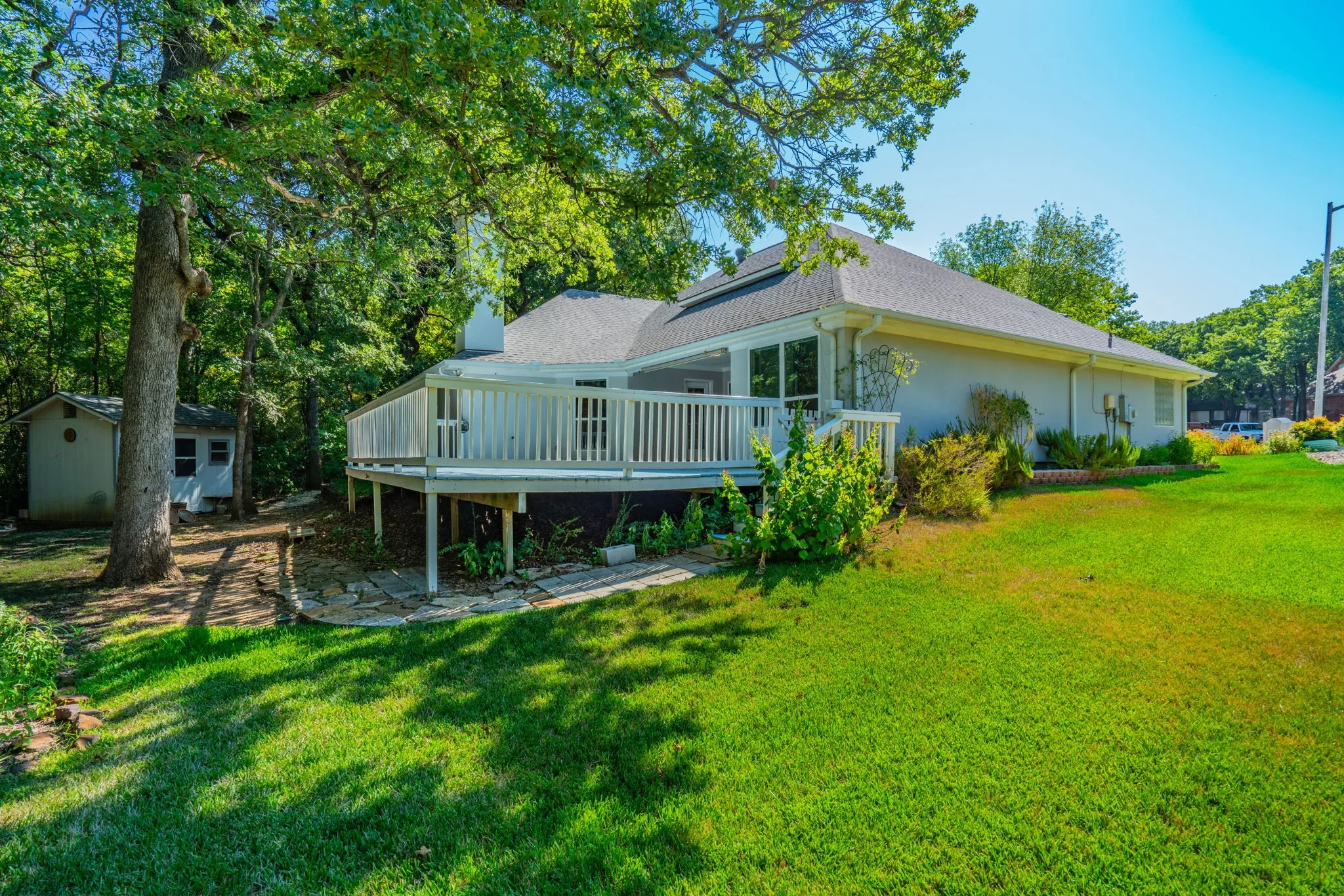 You can enjoy delightful mornings and evenings on the expansive patio & deck overlooking the forested back yard.