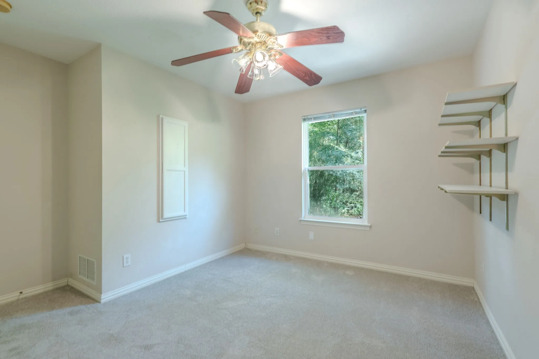 Another view of Bedroom #3 with recessed area and shallow storage cabinet
