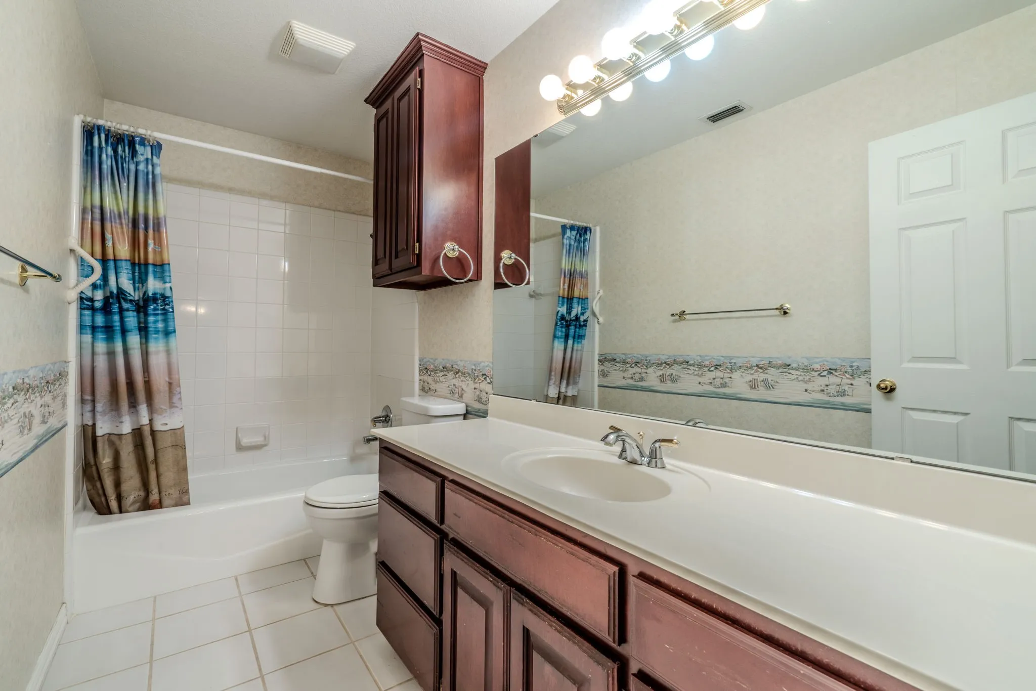 Secondary bathroom includes tile flooring, linen storage, and a tub/shower​​‌​​​​‌​​‌‌​‌‌​​​‌‌​‌​‌​‌​​​‌​​ combination.