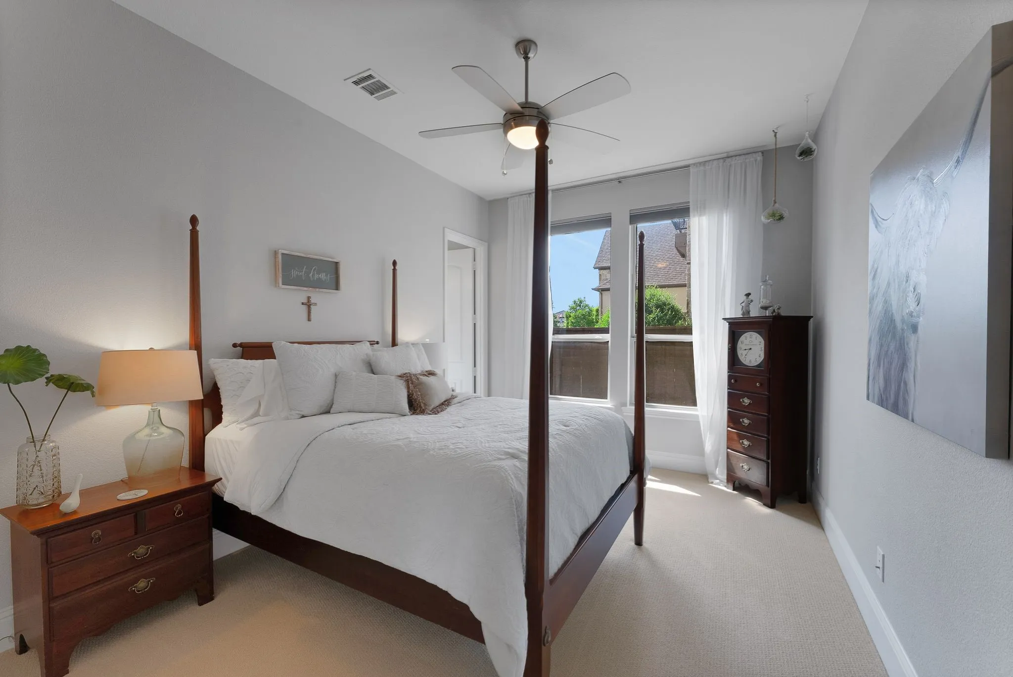 Recessed lighting, ceiling fan, neutral wall paint, dual windows, and light-colored carpeting