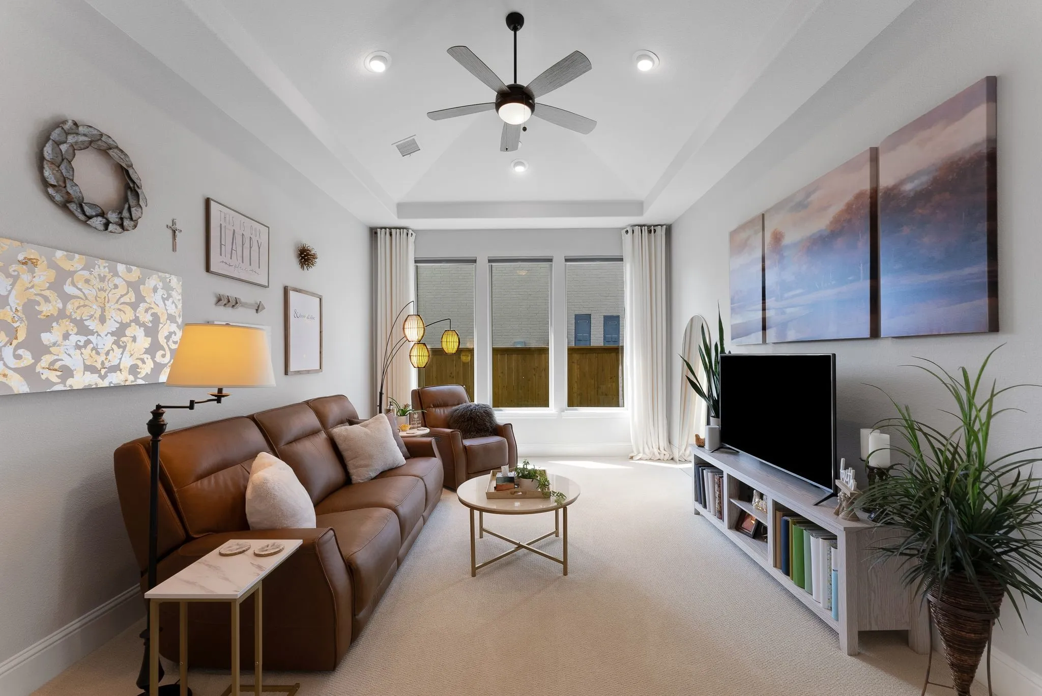 Tray ceiling with recessed lighting and a ceiling fan