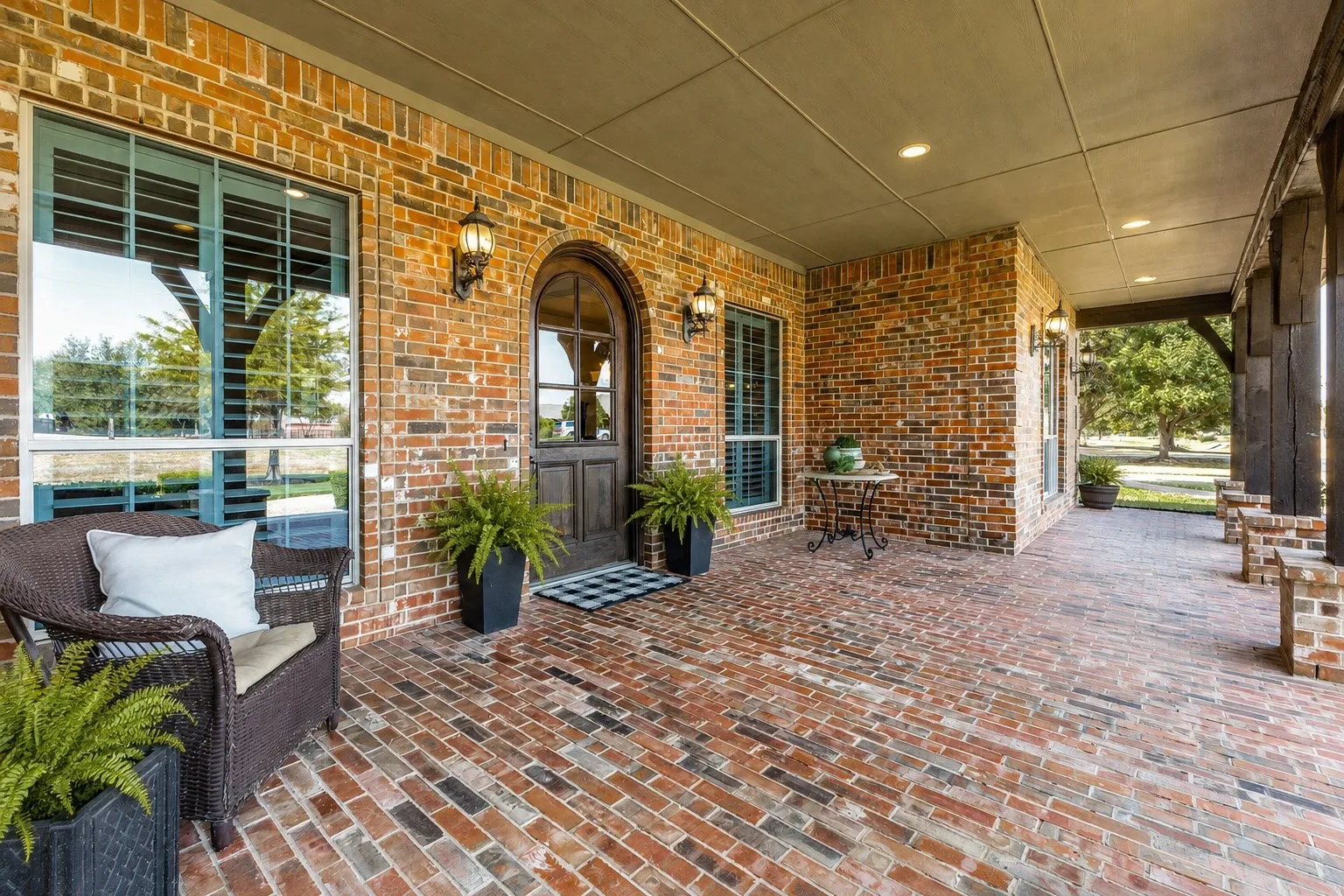 Give your guests a big Southern welcome from the expansive brick porch.