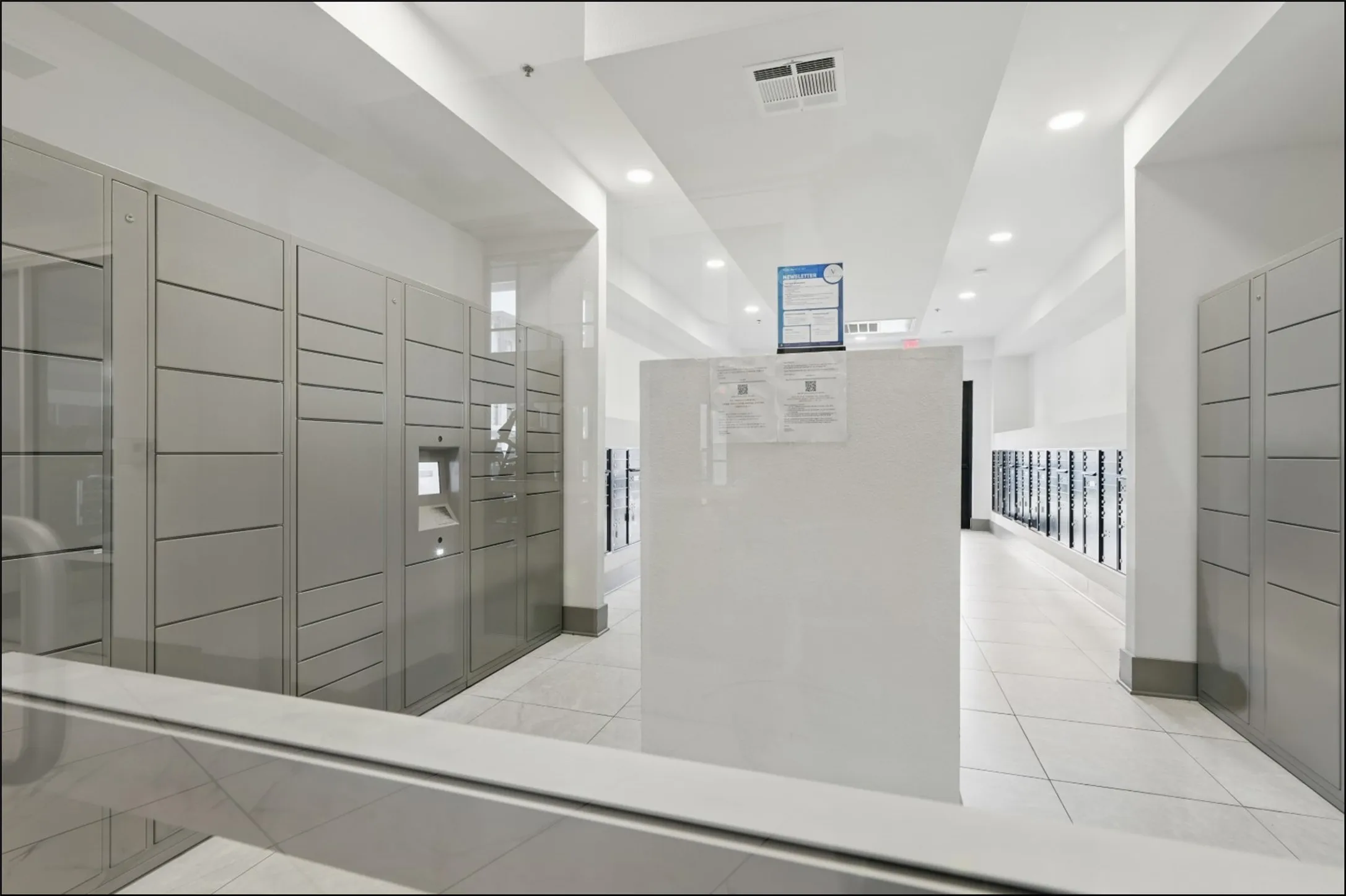 Central mailroom featuring an automated package locker system