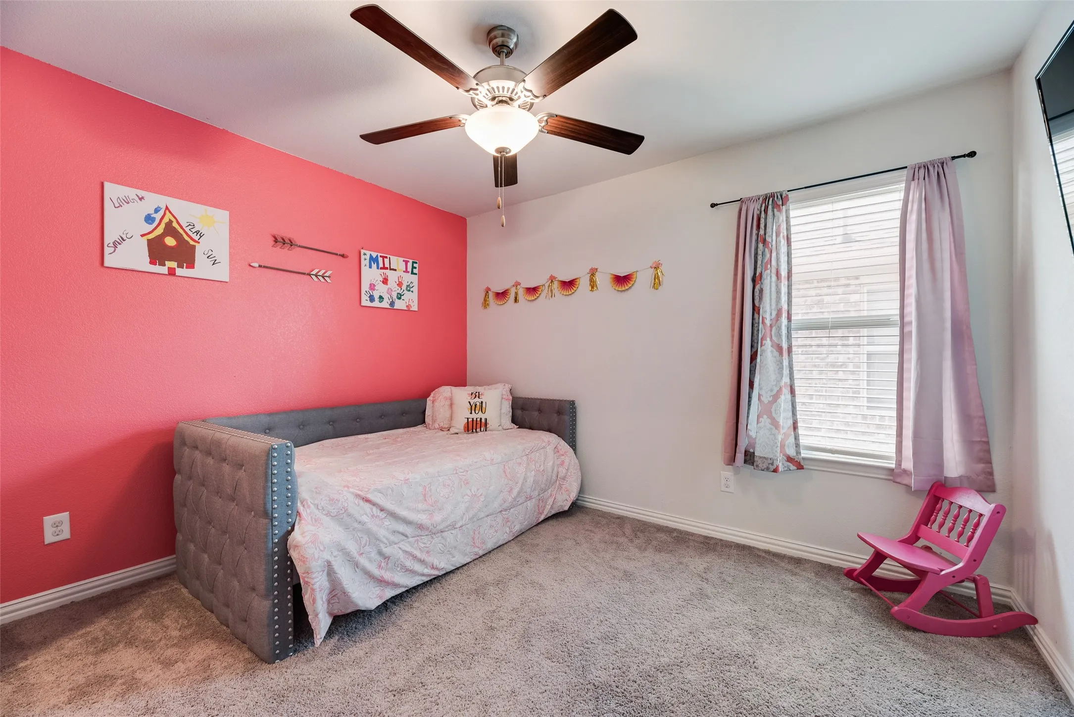This is a Nice size upstairs room with a ceiling fan and walk-in closet!