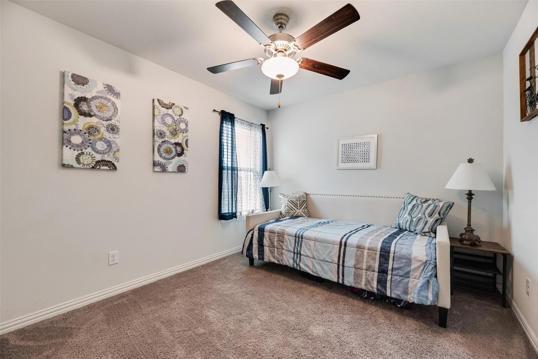 This is another Nice size upstairs bedroom with a ceiling fan and walk-in closet!
