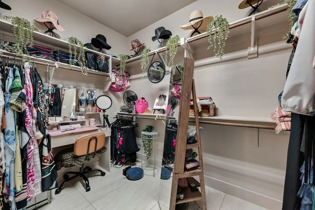 VERY Spacious Master Closet featuring Built-In shelving.