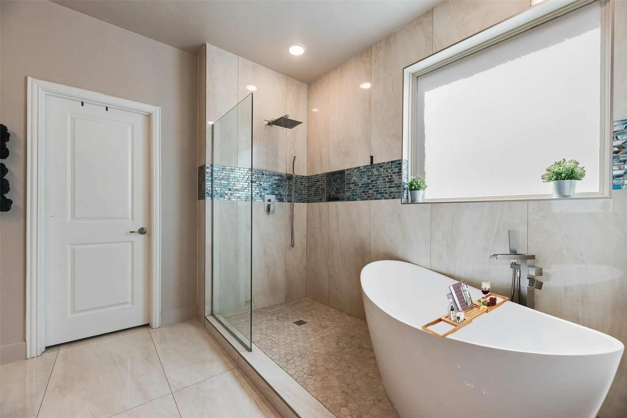 The master bathroom features a relaxing free-standing tub!