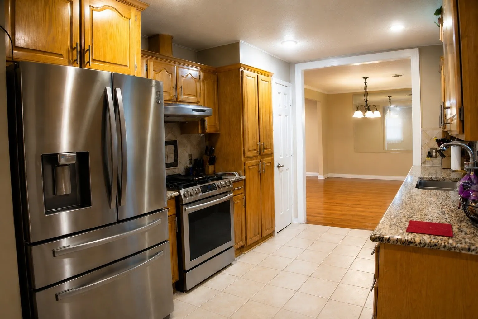 Stainless steel refrigerator, range, and hood