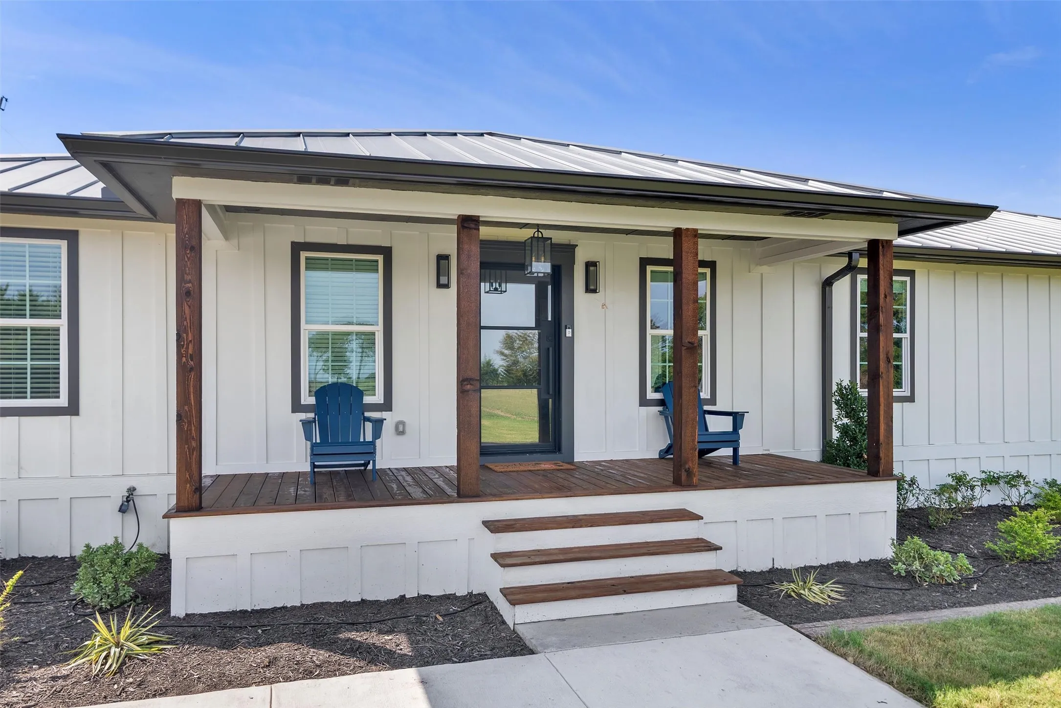 White board-and-batten exterior with dark trim