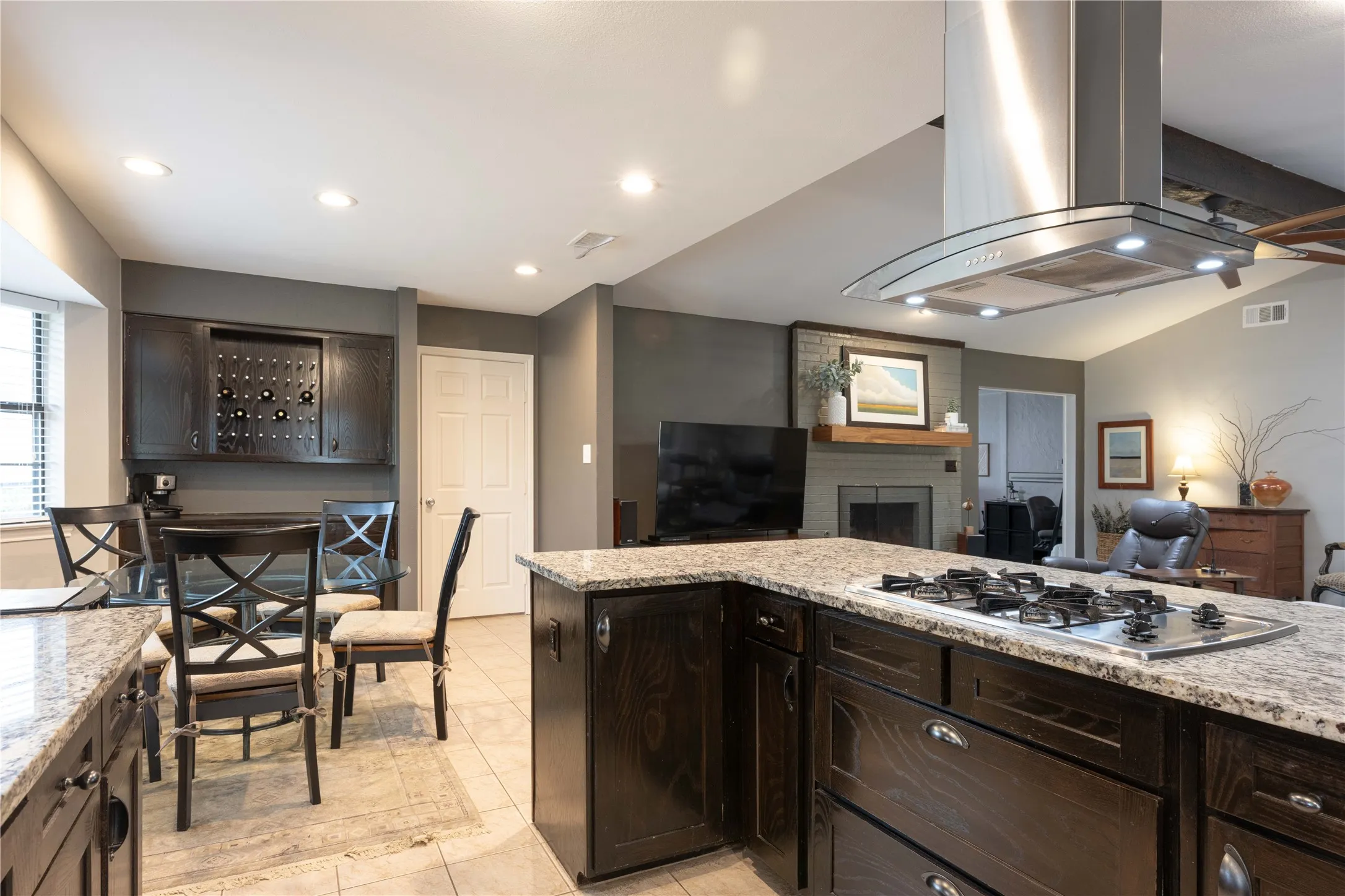 Remodeled open Kitchen with abundant cabinets, granite counter tops & island.