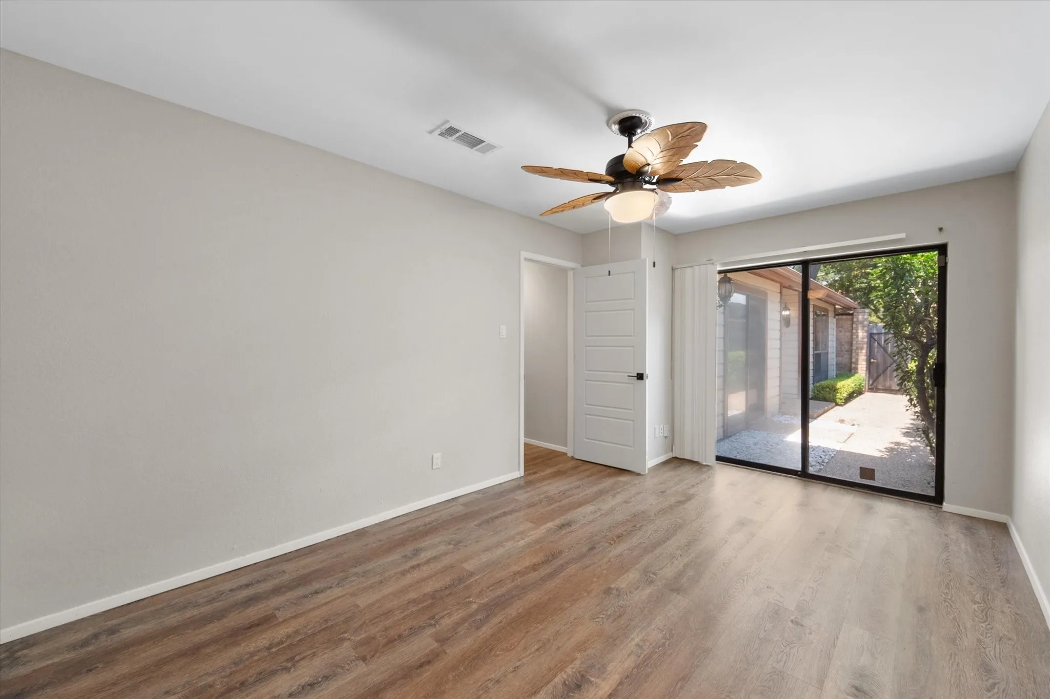 Secondary bedroom (1) - large with a cedar closet and floor safe and access to front courtyard