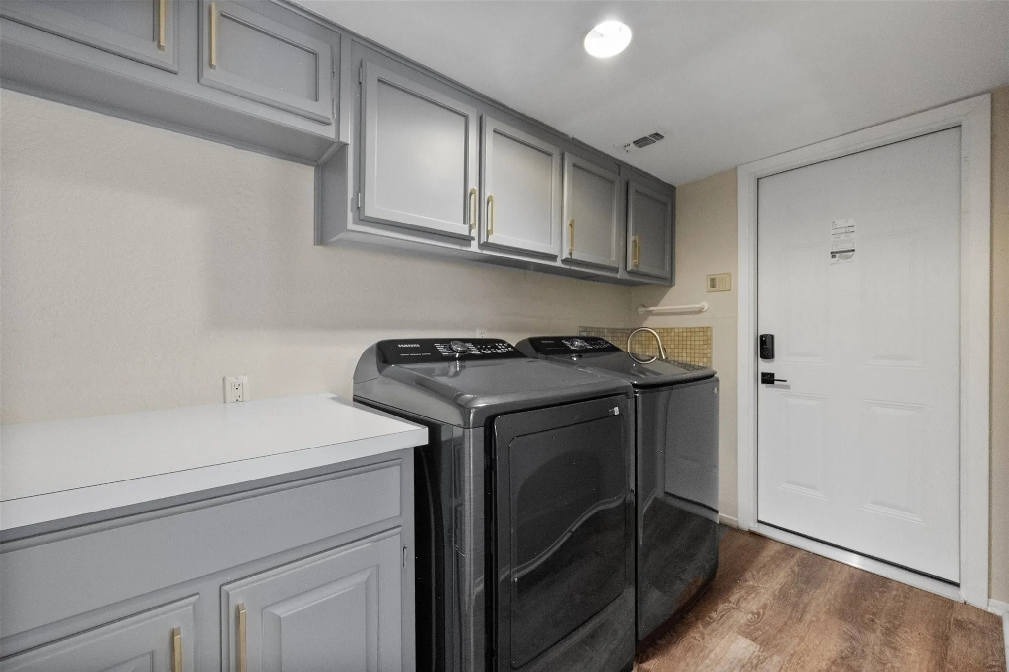 Laundry room with sink and folding counter