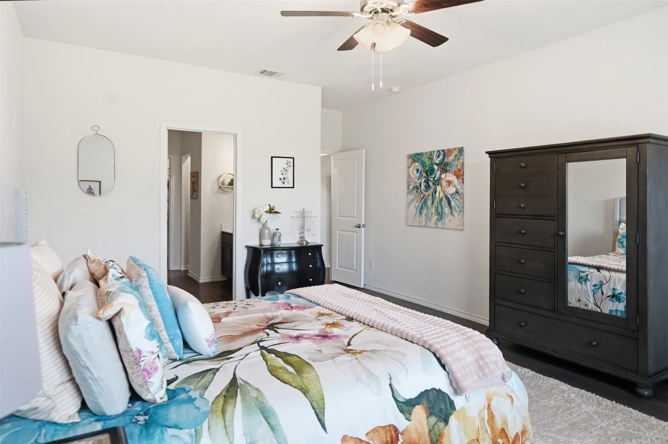 Recessed lighting, wood-finish flooring, and a ceiling fan with integrated lighting