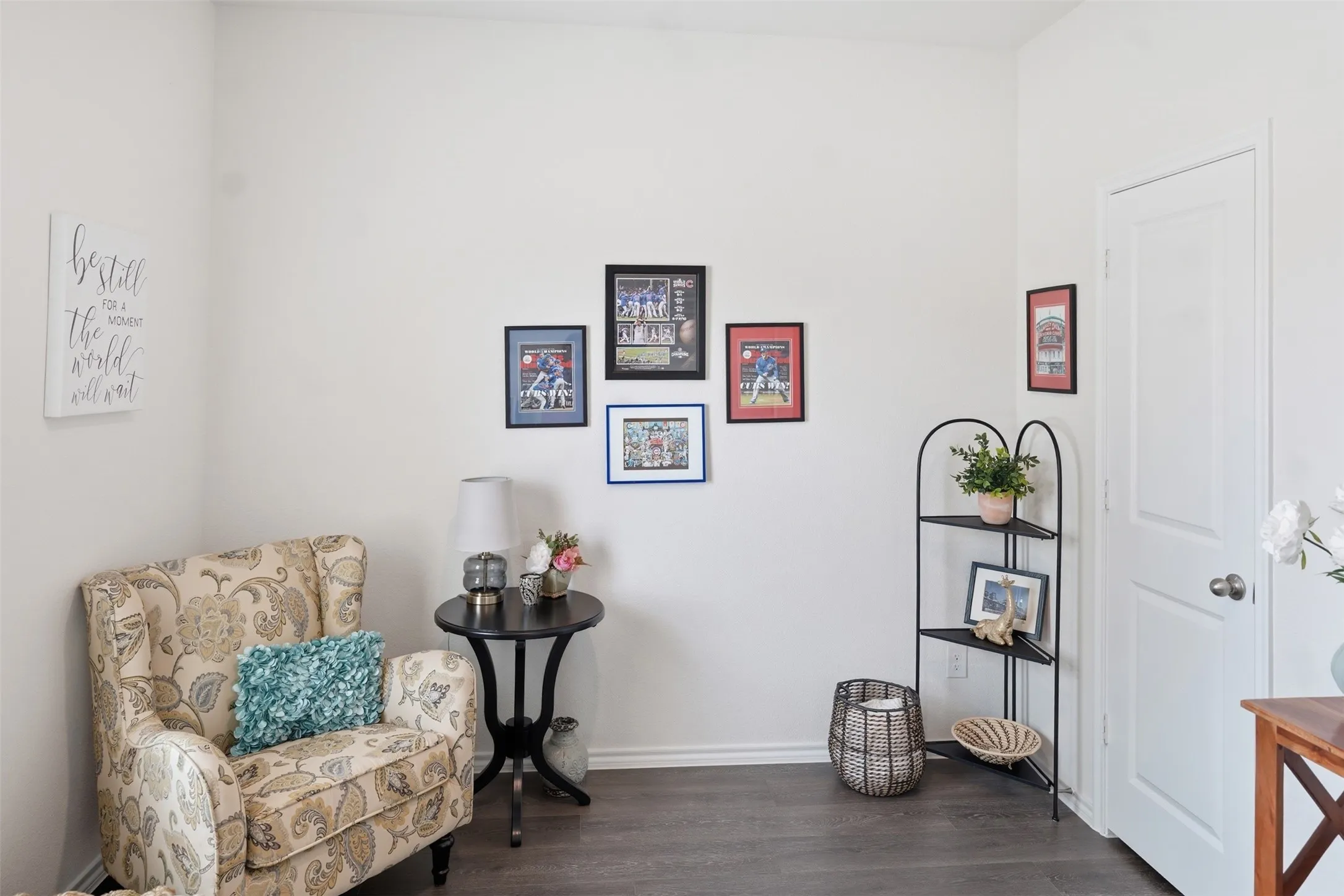 Bedroom 2 - Smooth white walls with wood-finish flooring