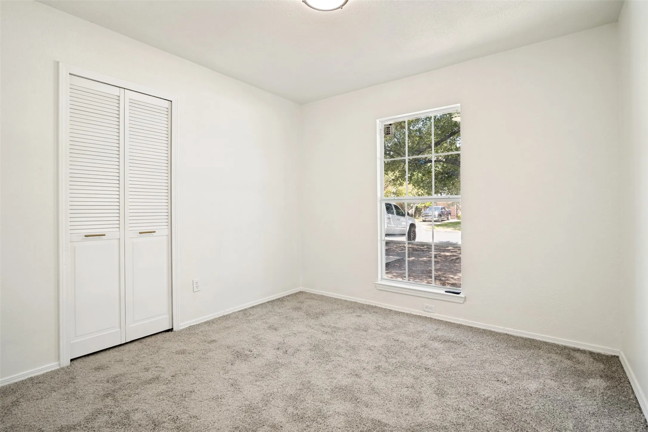Neutral-toned carpeting throughout