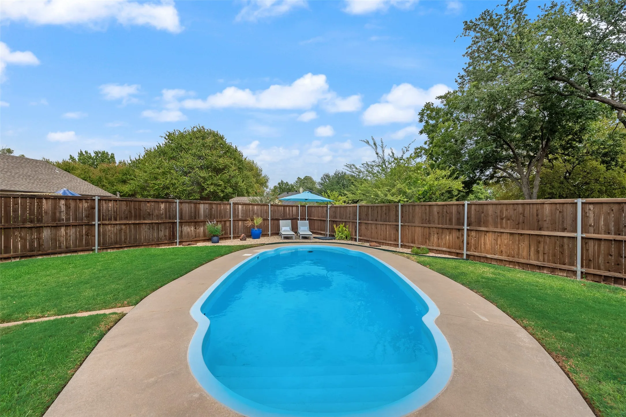 Sparkling pool has additional sunning area.
