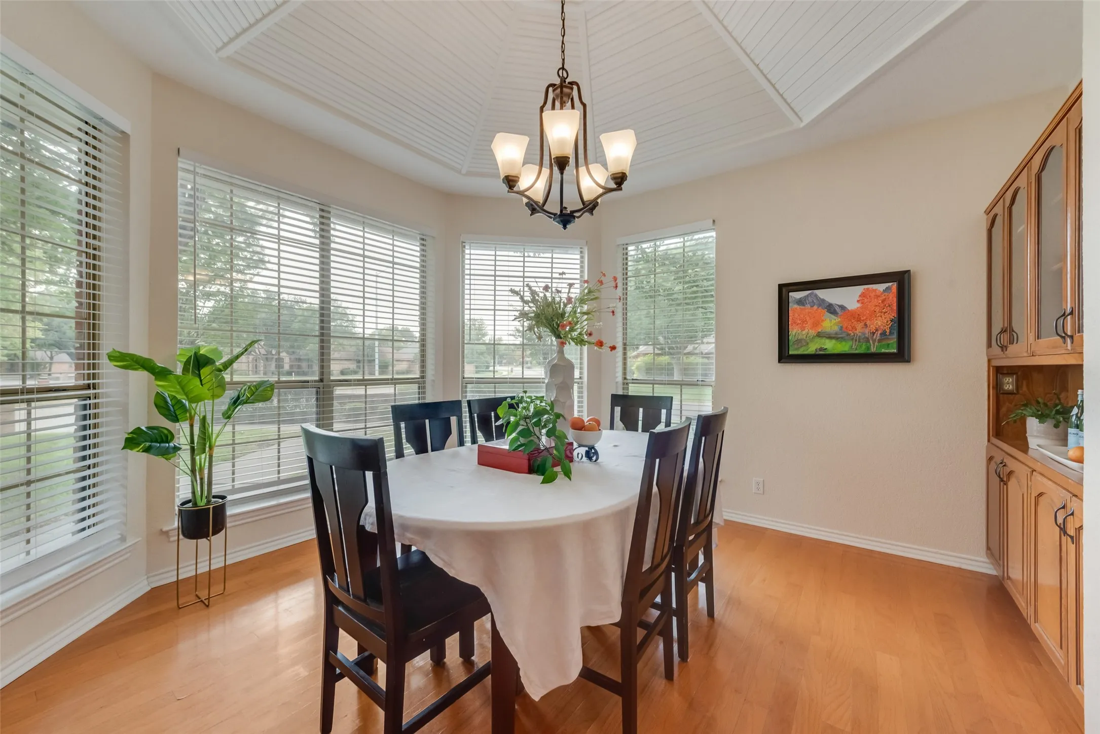 Flex/Dining Space has bay windows and a vaulted paneled tent ceiling and built in cabinetry.