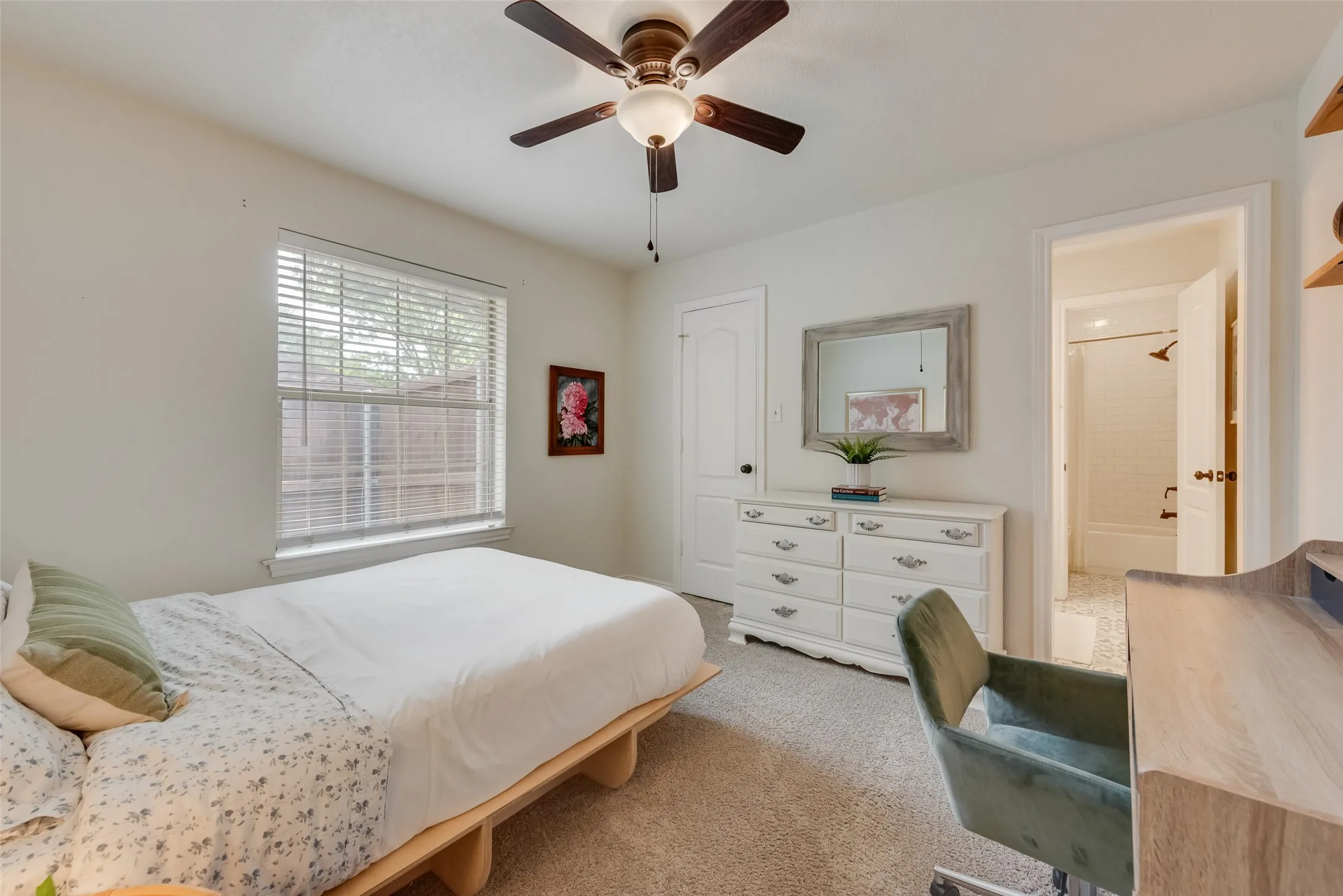 Secondary bedroom has a private vanity with sink and walk in closet.