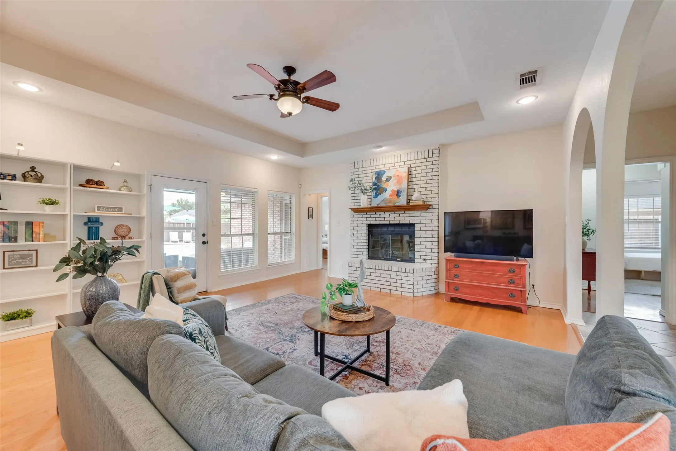 Architectural details like the tray ceiling and archways make this home special