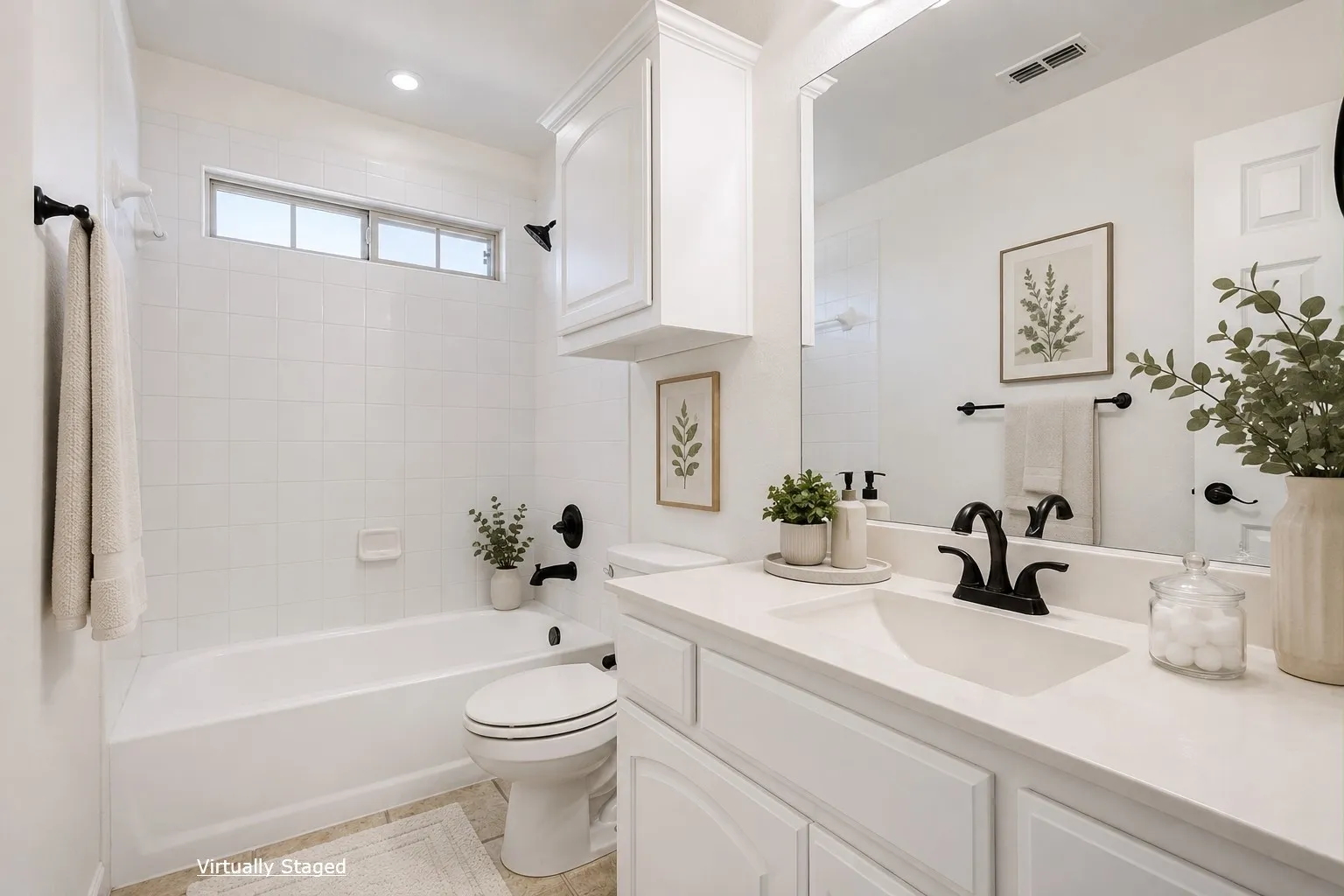White tile tub and shower combination with a transom window