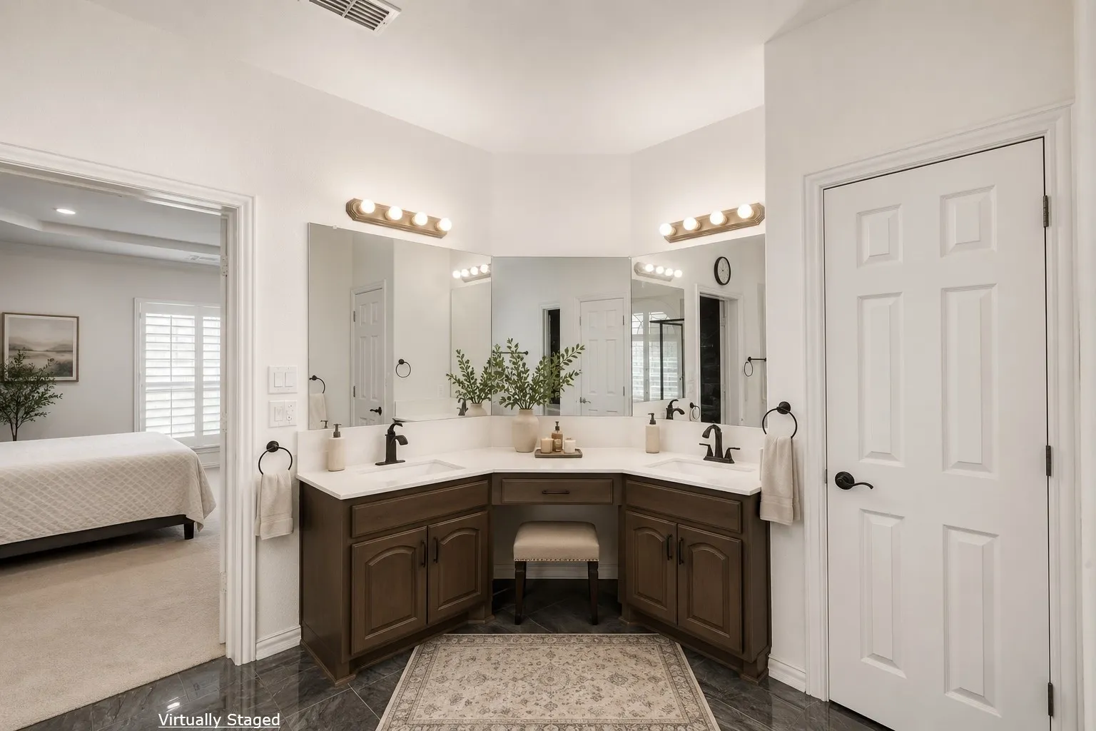 Dual sink vanity with dark wood-finish cabinetry, white countertops, and integrated makeup vanity