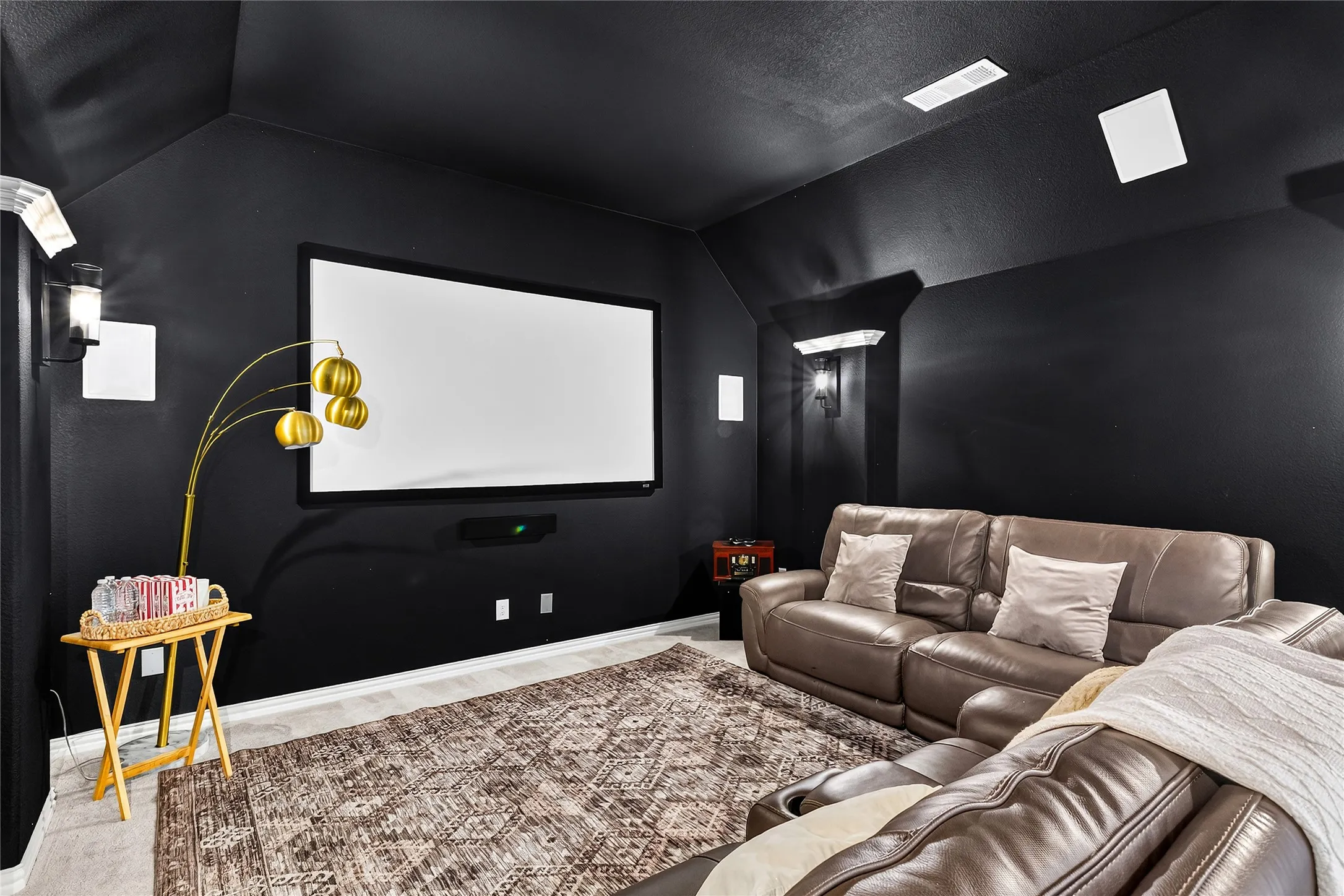 Dedicated home theater with projector, surround sound and ready for movie nights
