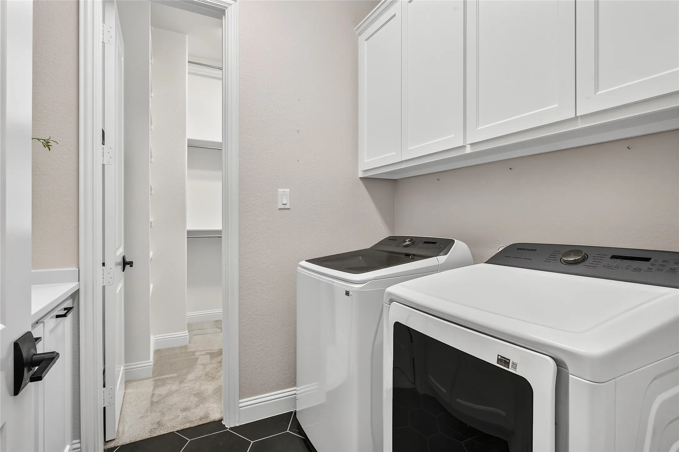 Utility room directly accessible from primary closet and mudroom.