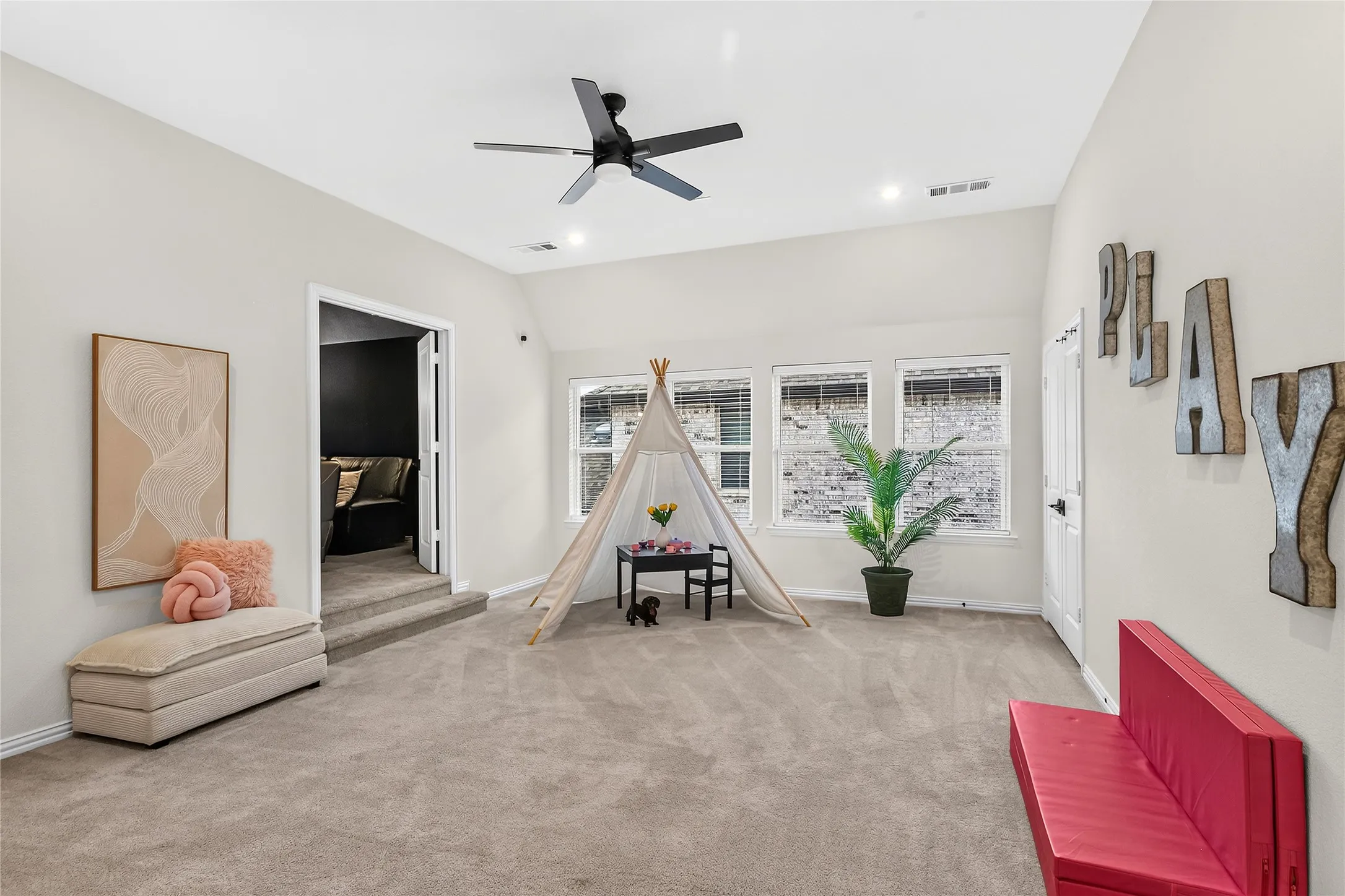 A bright, roomy game space with abundant natural light and flexible layout.