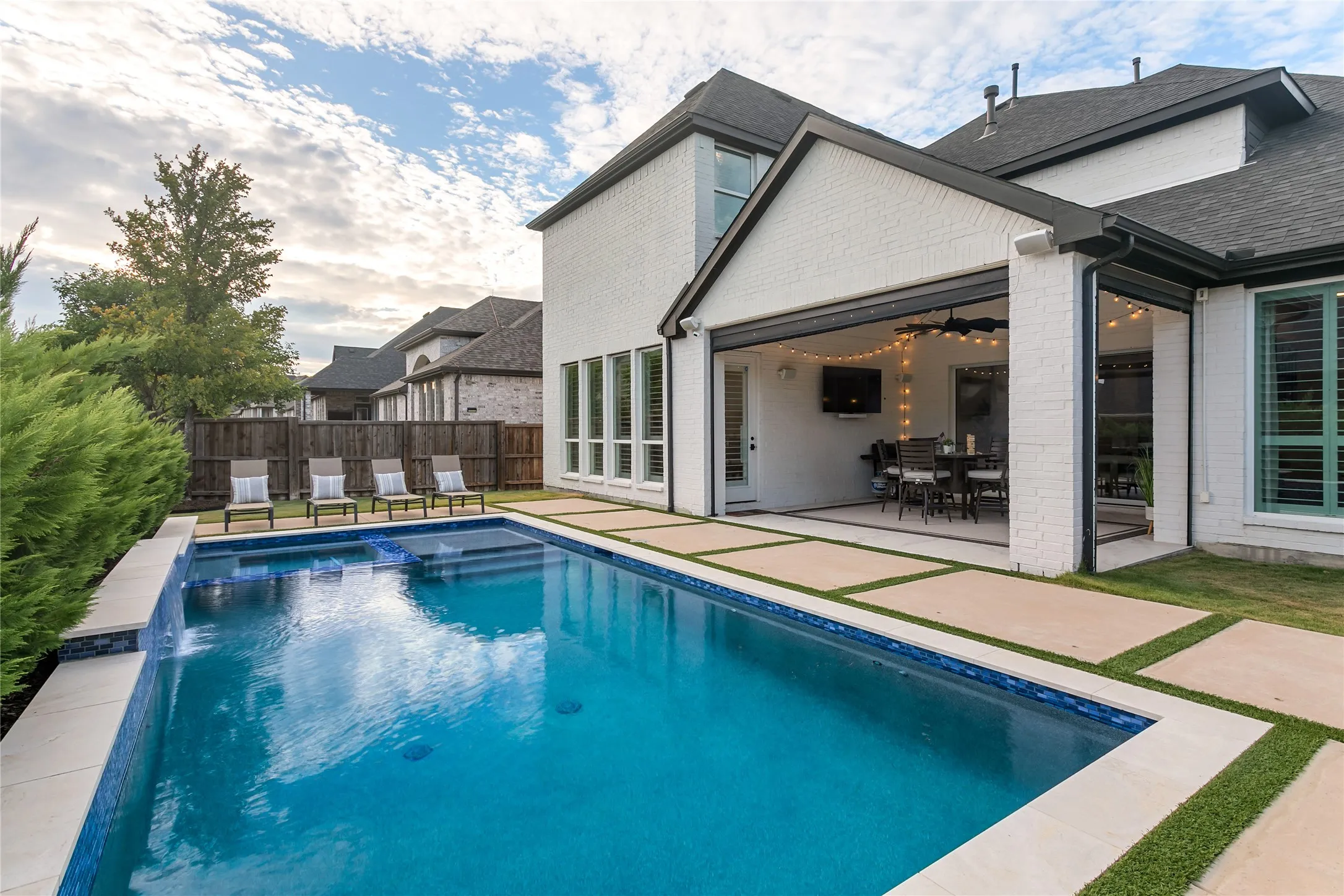 Additional view of the pool and outdoor living space