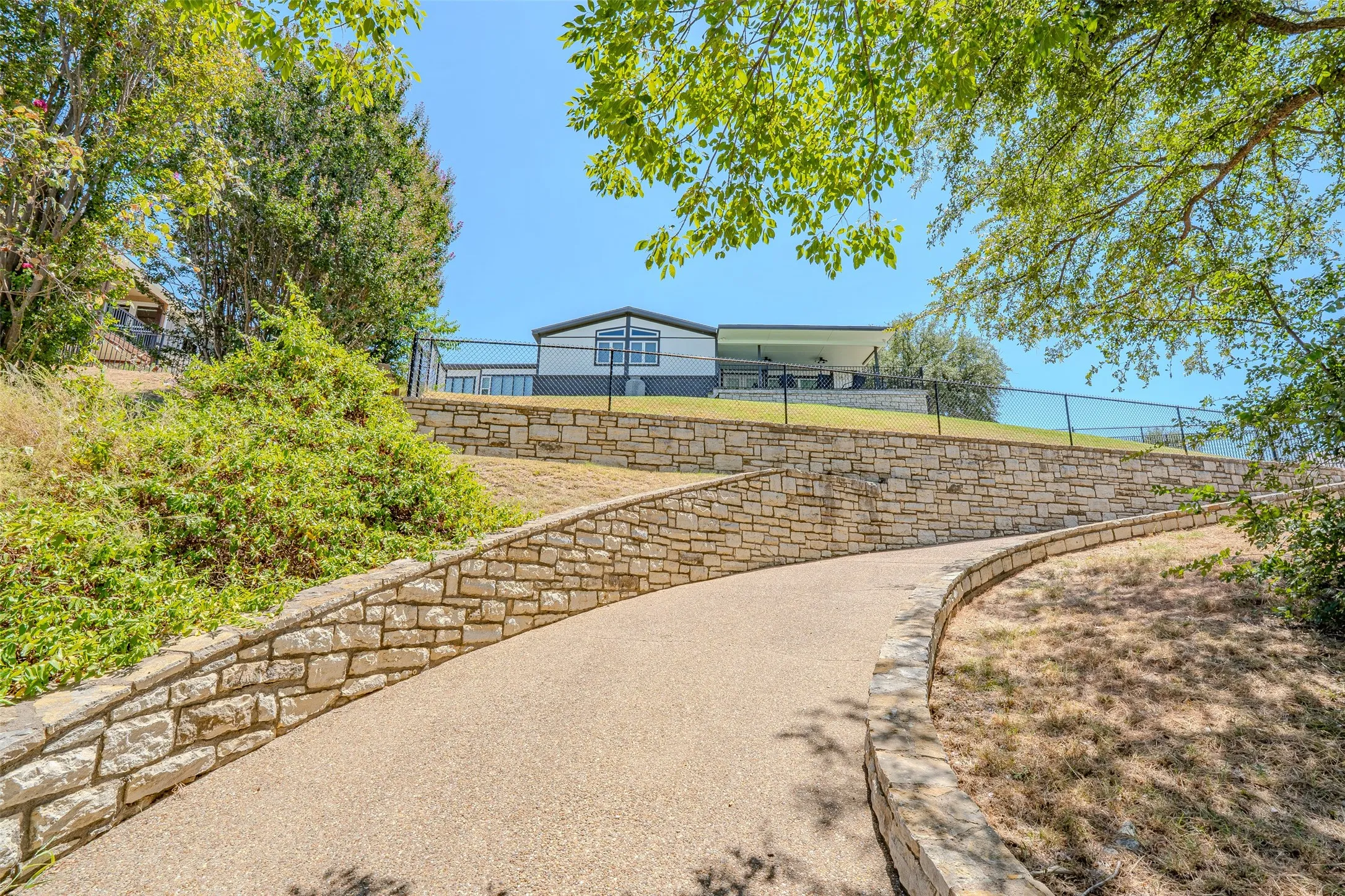 Concrete drive to the dock lakefront