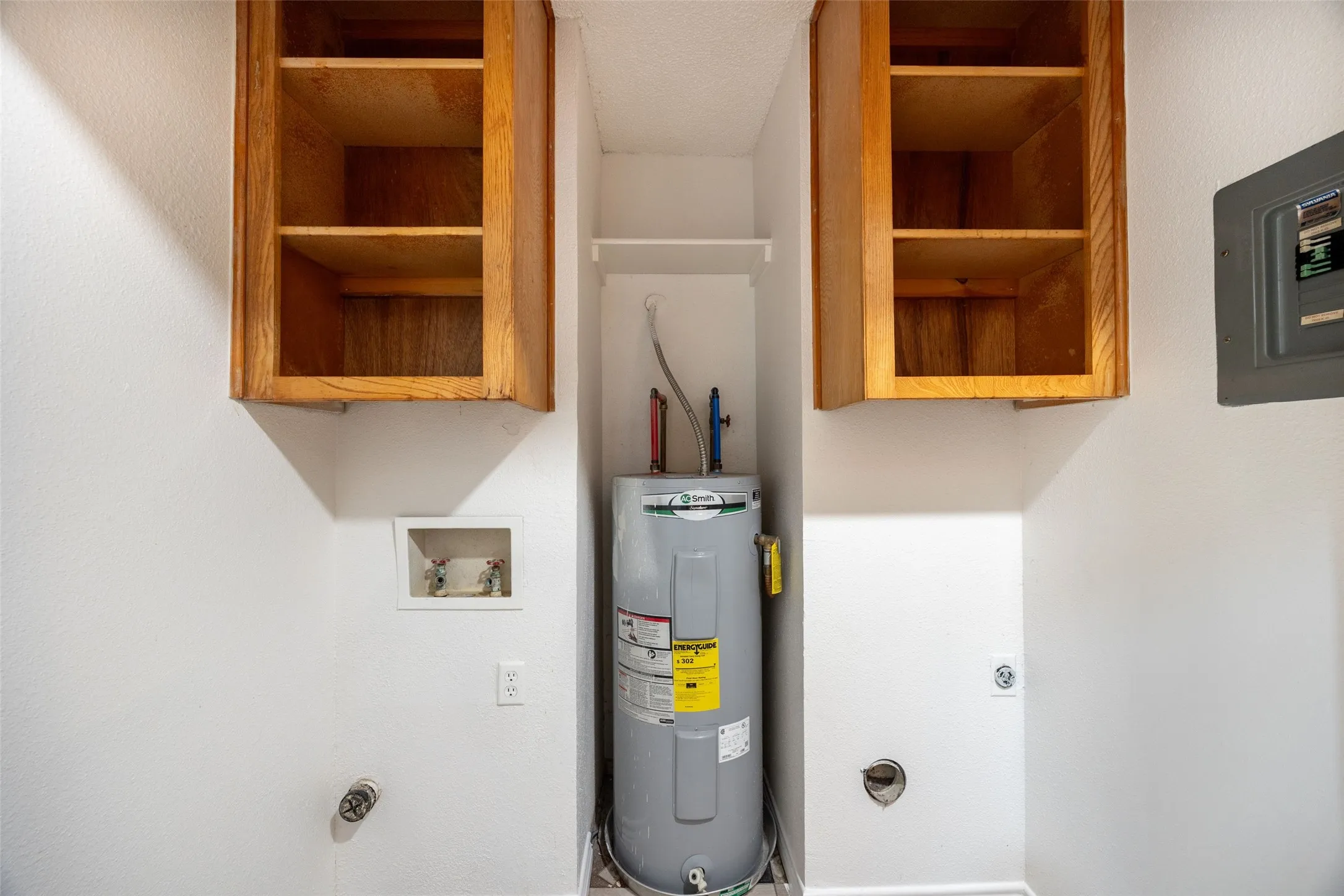 Washer Dryer area with hot water heater